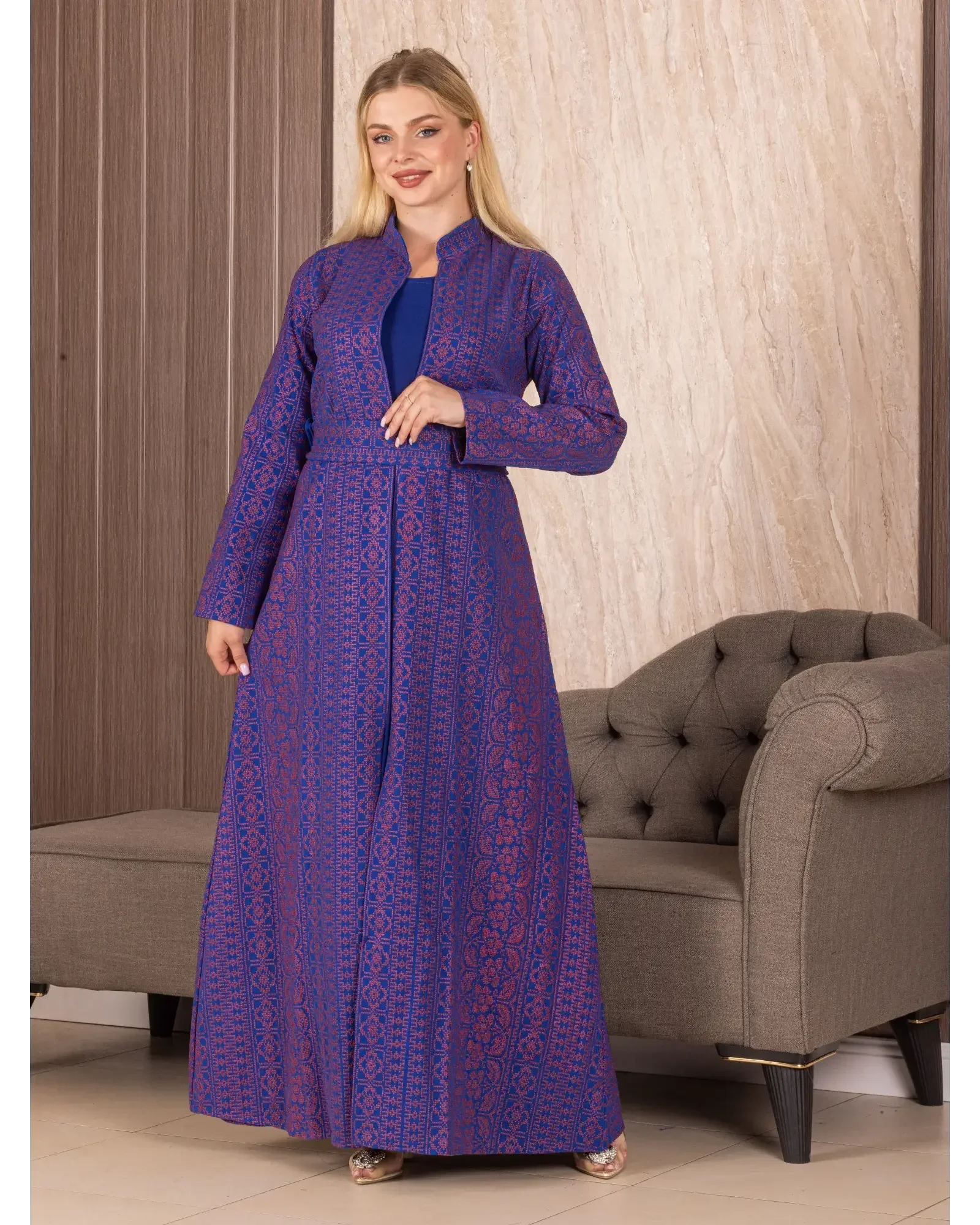 Palestinian Elegance embroidered long cardigan in purple with intricate traditional patterns worn by a woman