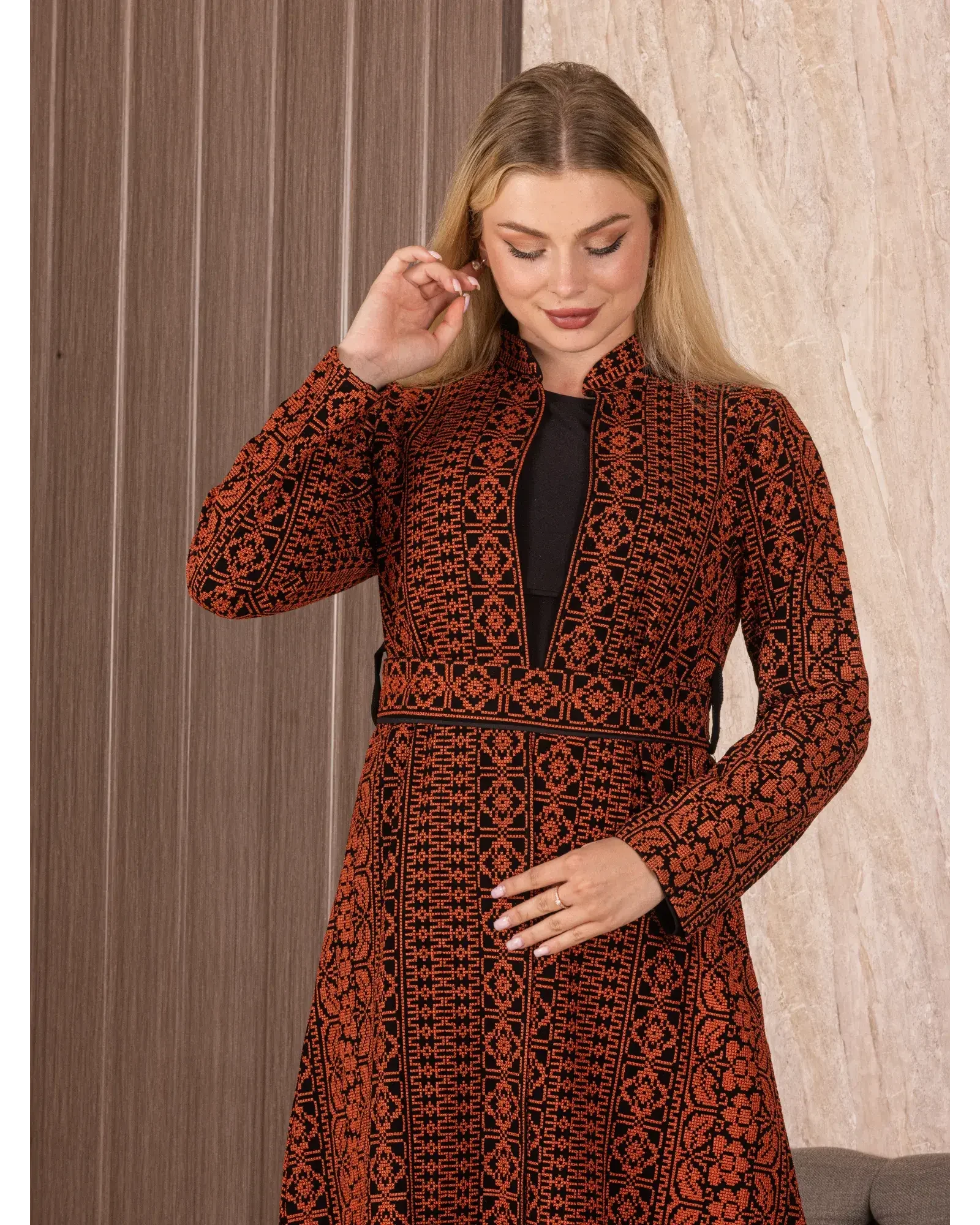 Palestinian Elegance embroidered long cardigan with intricate black and orange traditional patterns