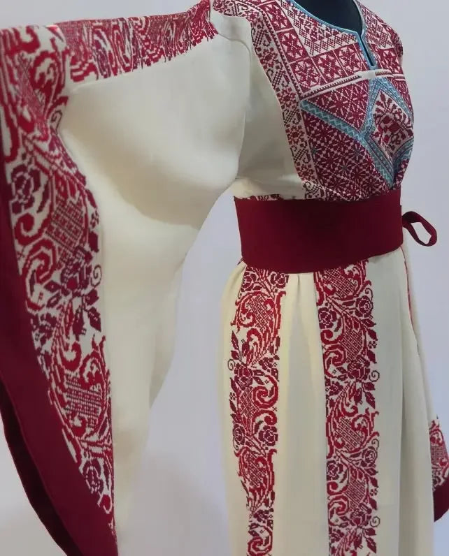 Palestinian Elegance embroidered modest fashion dress with intricate red embroidery on cream fabric