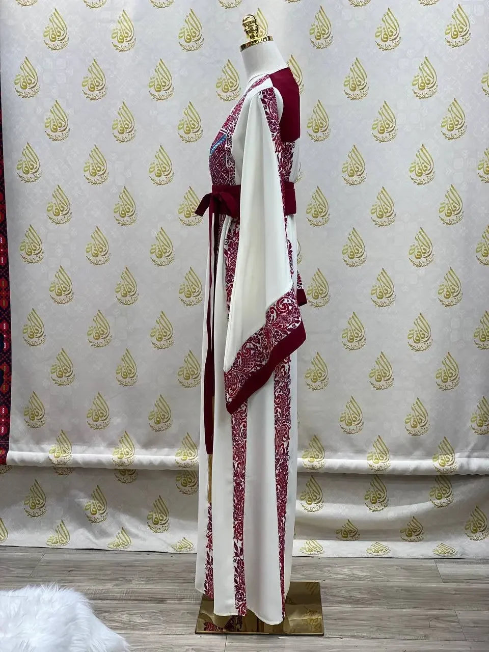 Palestinian Elegance embroidered modest fashion dress in white and maroon with detailed traditional embroidery