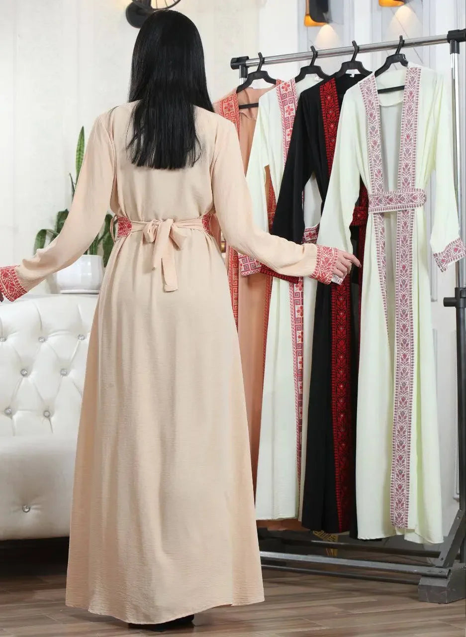 Palestinian Elegance embroidered open cardigan in beige with traditional red embroidery and belt shown from back
