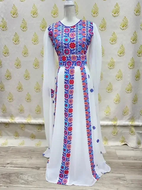 White embroidered Palestinian dress with colorful floral embroidery on bodice and front panel by Palestinian Elegance