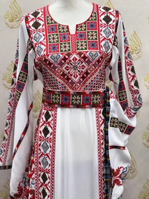 White embroidered Palestinian Elegance thoub with intricate red and multicolor traditional embroidery patterns
