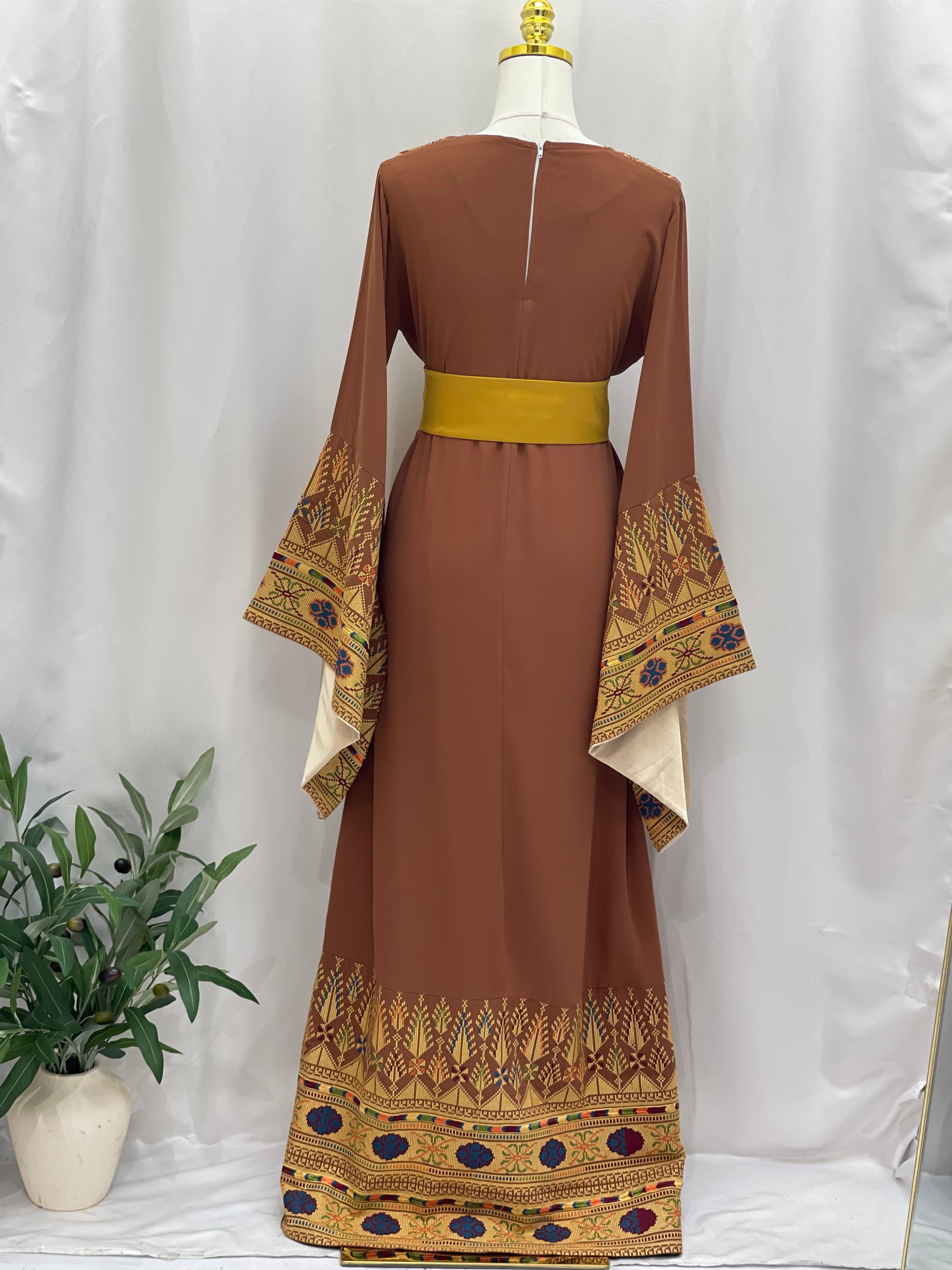 Embroidered Palestinian thoub dress in brown with traditional colorful embroidery on sleeves and hem by Palestinian Elegance