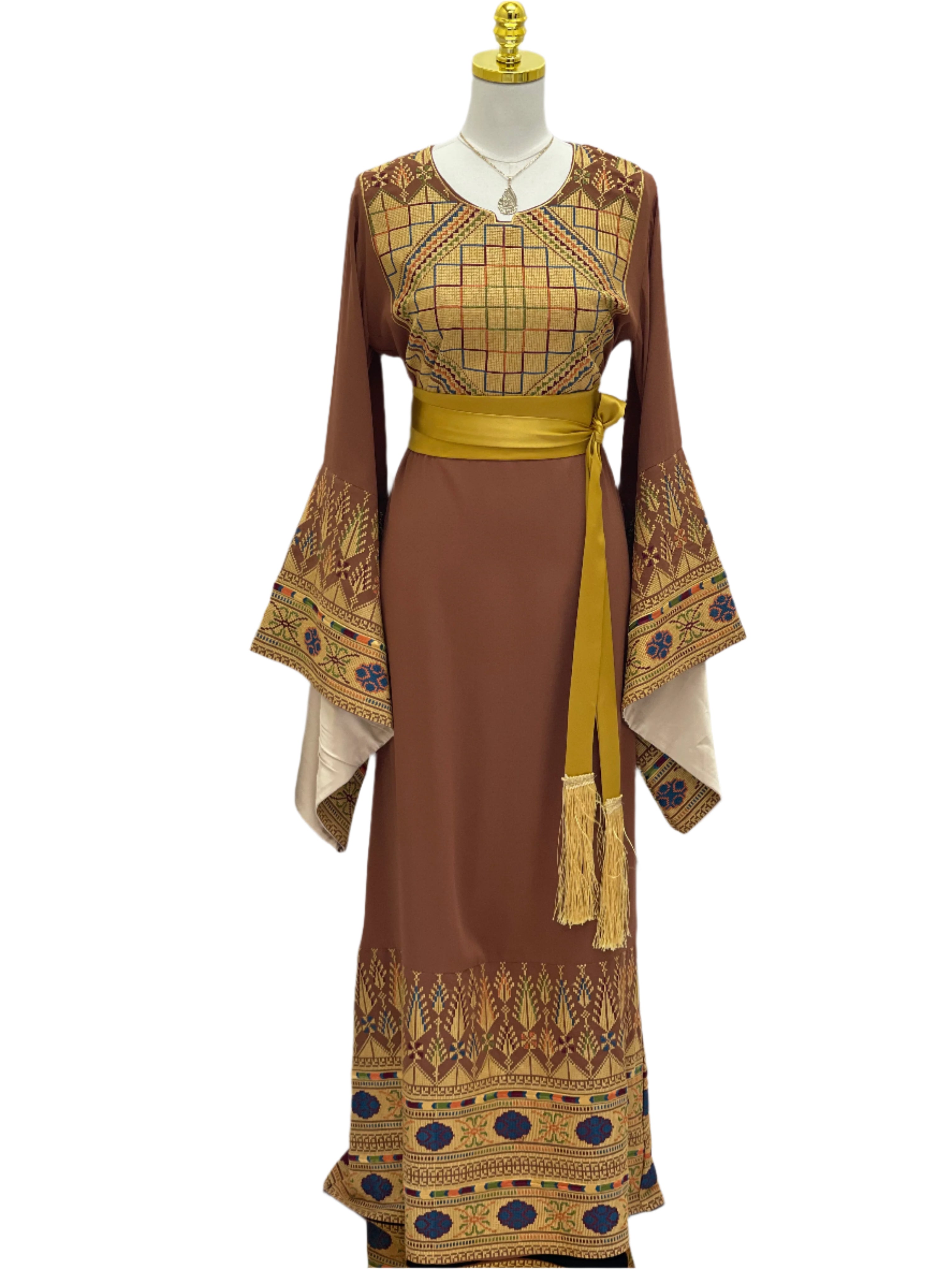Embroidered Palestinian thoub dress in brown with intricate sleeve and hem embroidery and yellow sash belt