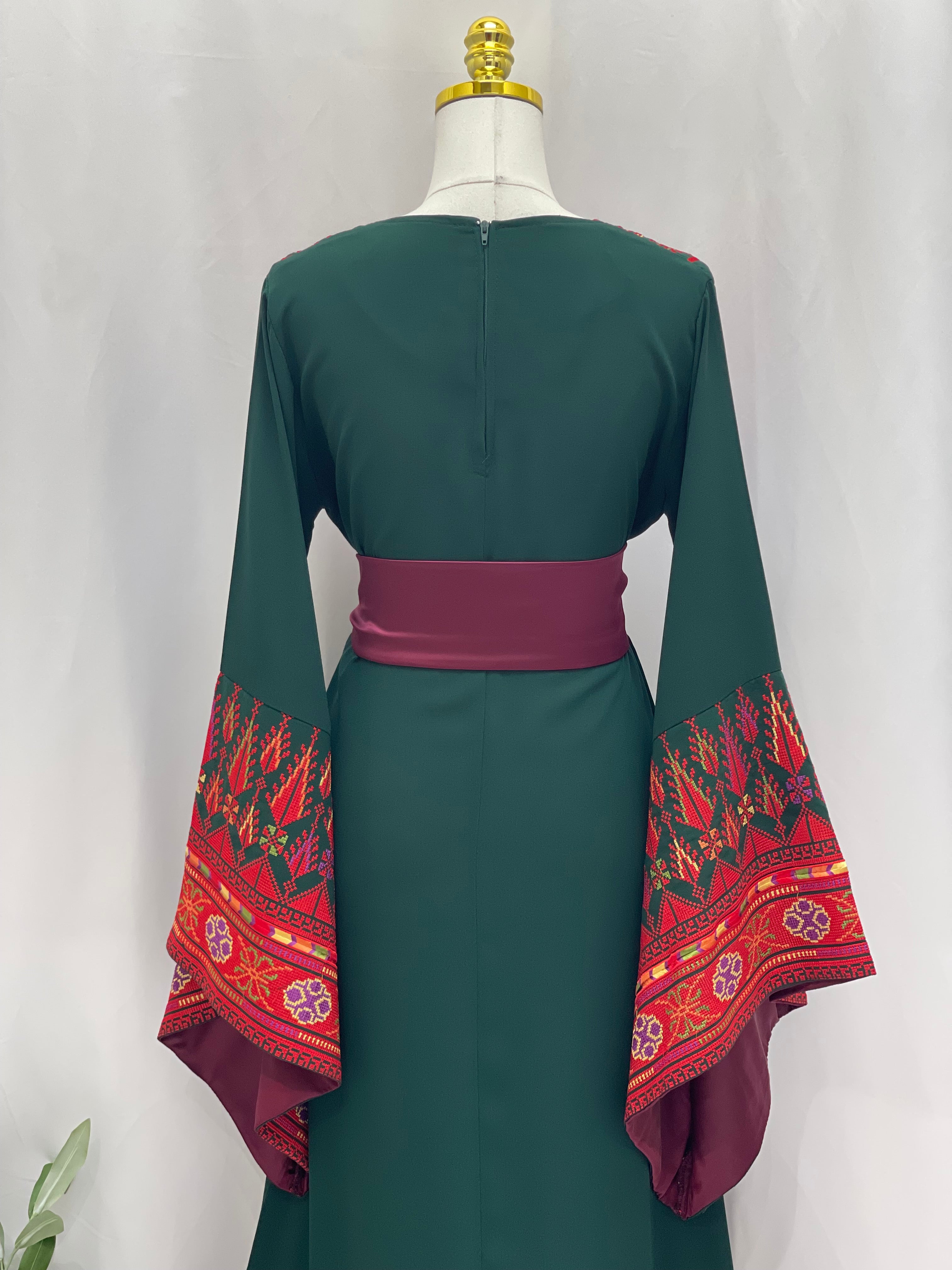 Embroidered Palestinian thoub dress by Palestinian Elegance with red and green traditional patterns fashion