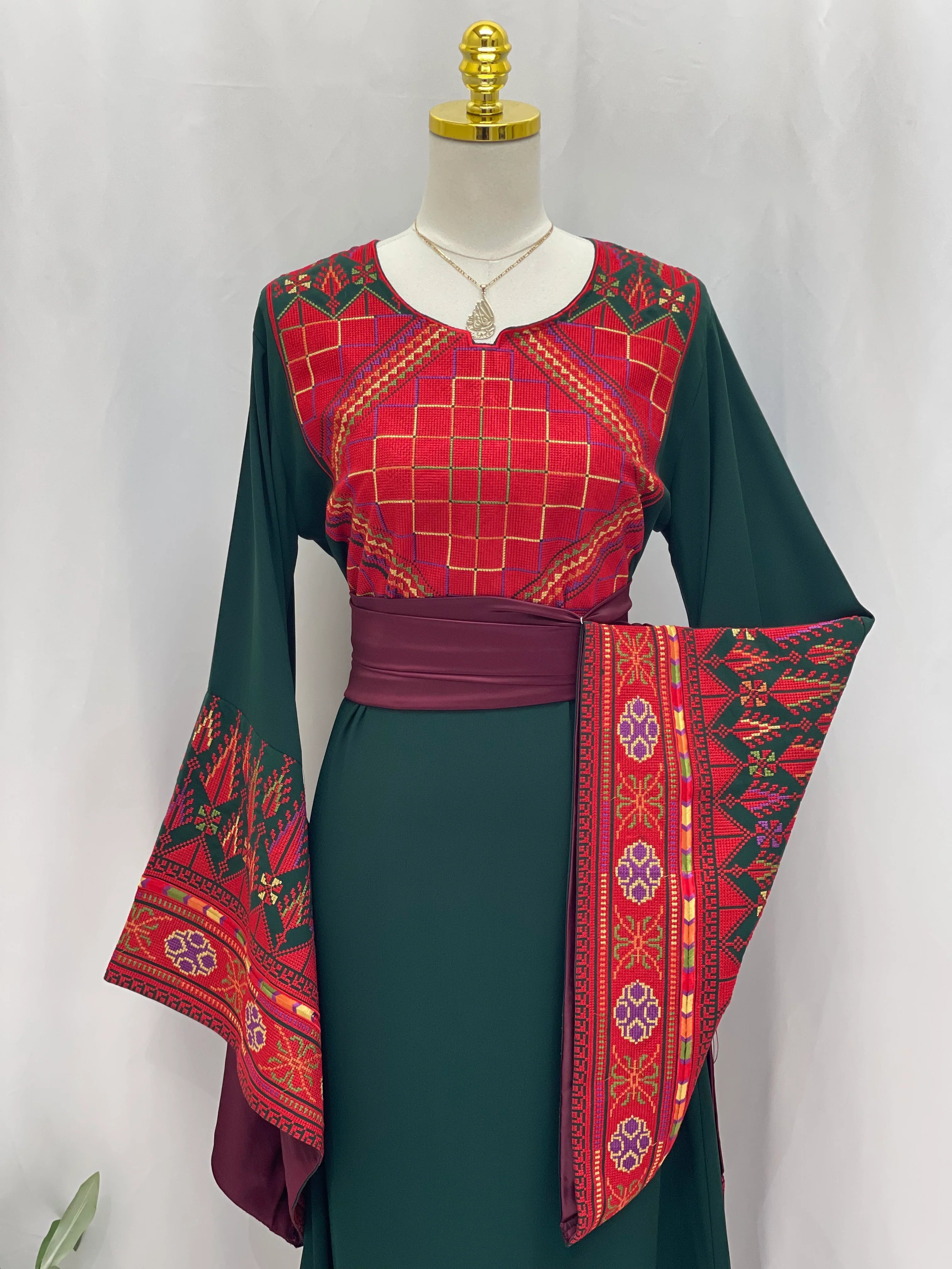 Embroidered Palestinian thoub dress by Palestinian Elegance with red and green traditional patterns new