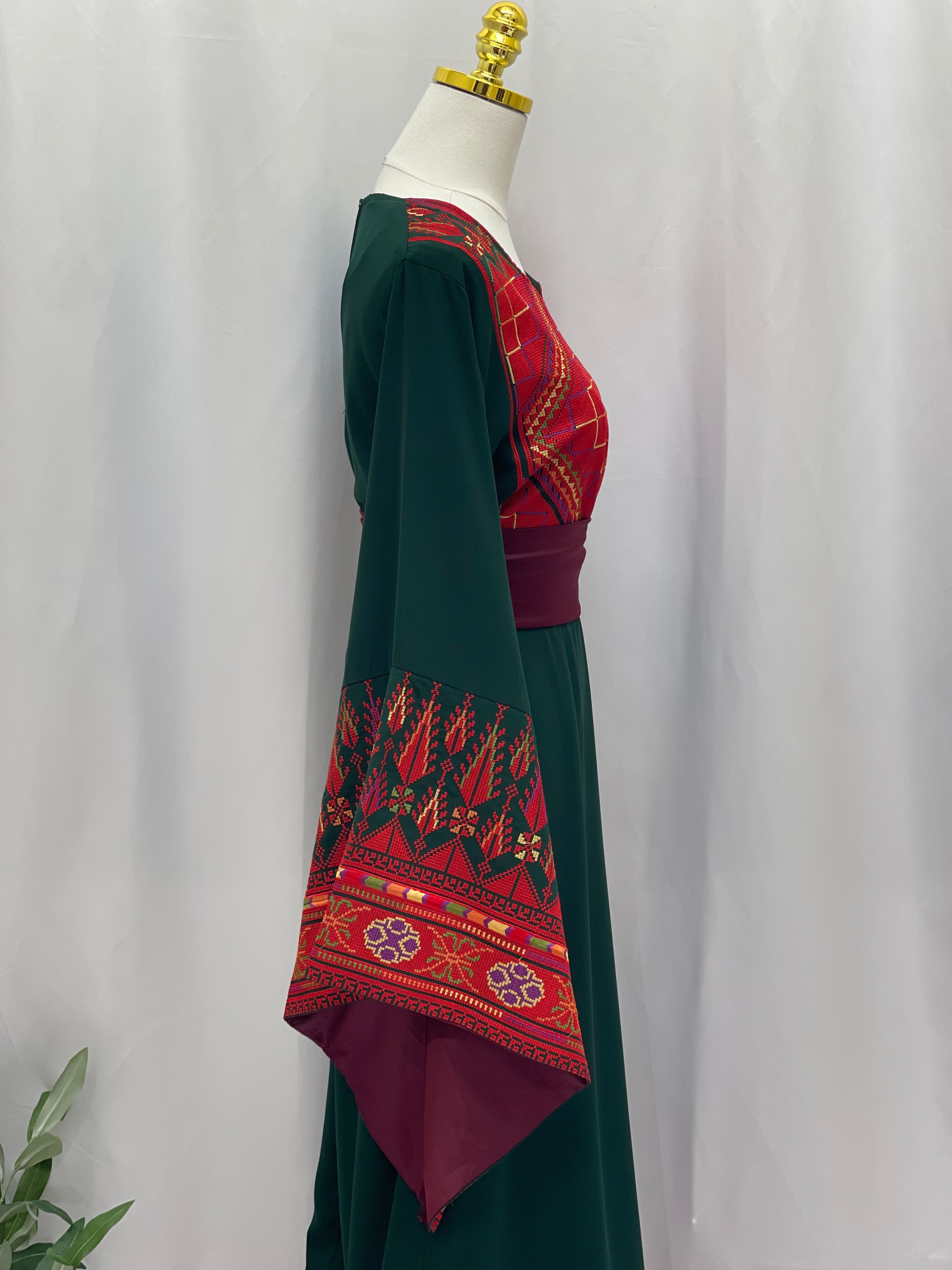 Embroidered Palestinian thoub dress by Palestinian Elegance with red and green traditional patterns handmade