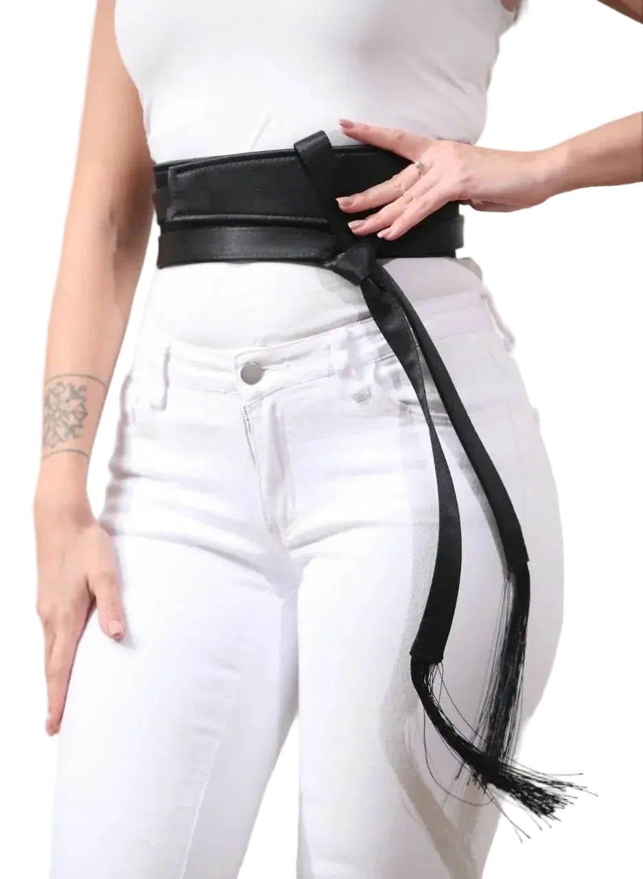 Black embroidered satin belt from Palestinian Elegance styled over white jeans and a white top