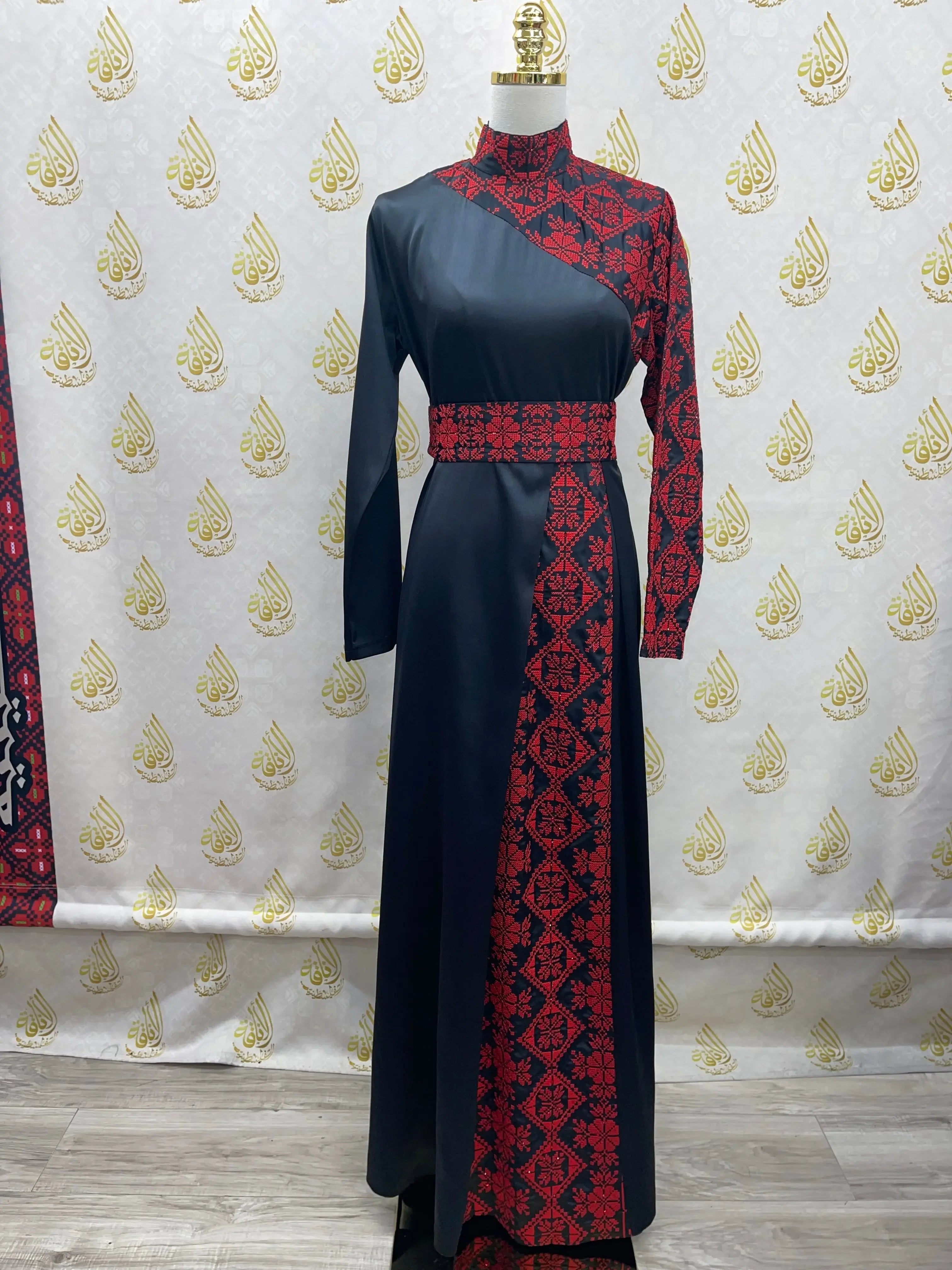 Palestinian Elegance embroidered satin dress in black with red traditional embroidery and long sleeves