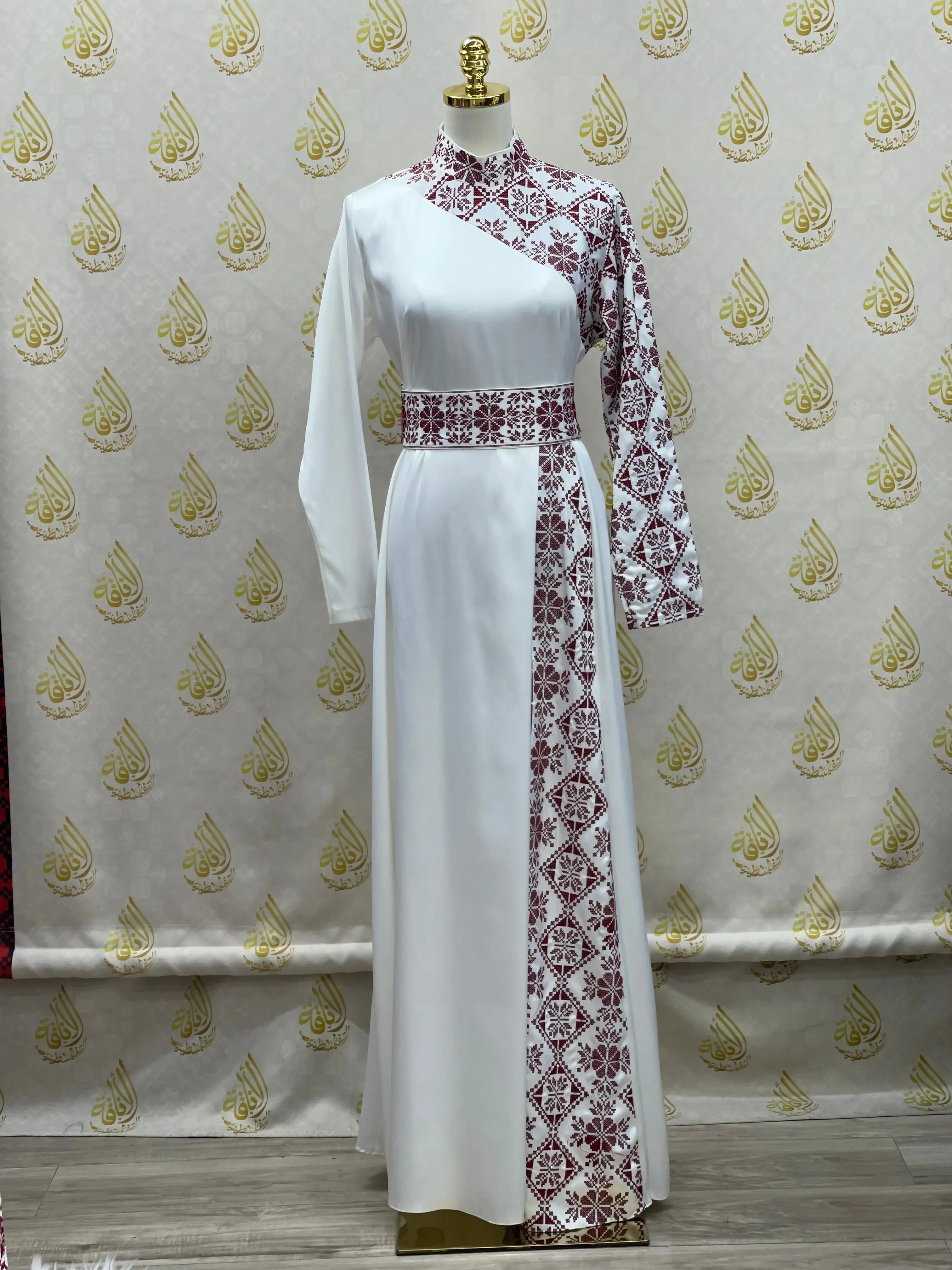 Palestinian Elegance white embroidered satin dress with maroon traditional embroidery on one sleeve and side panel