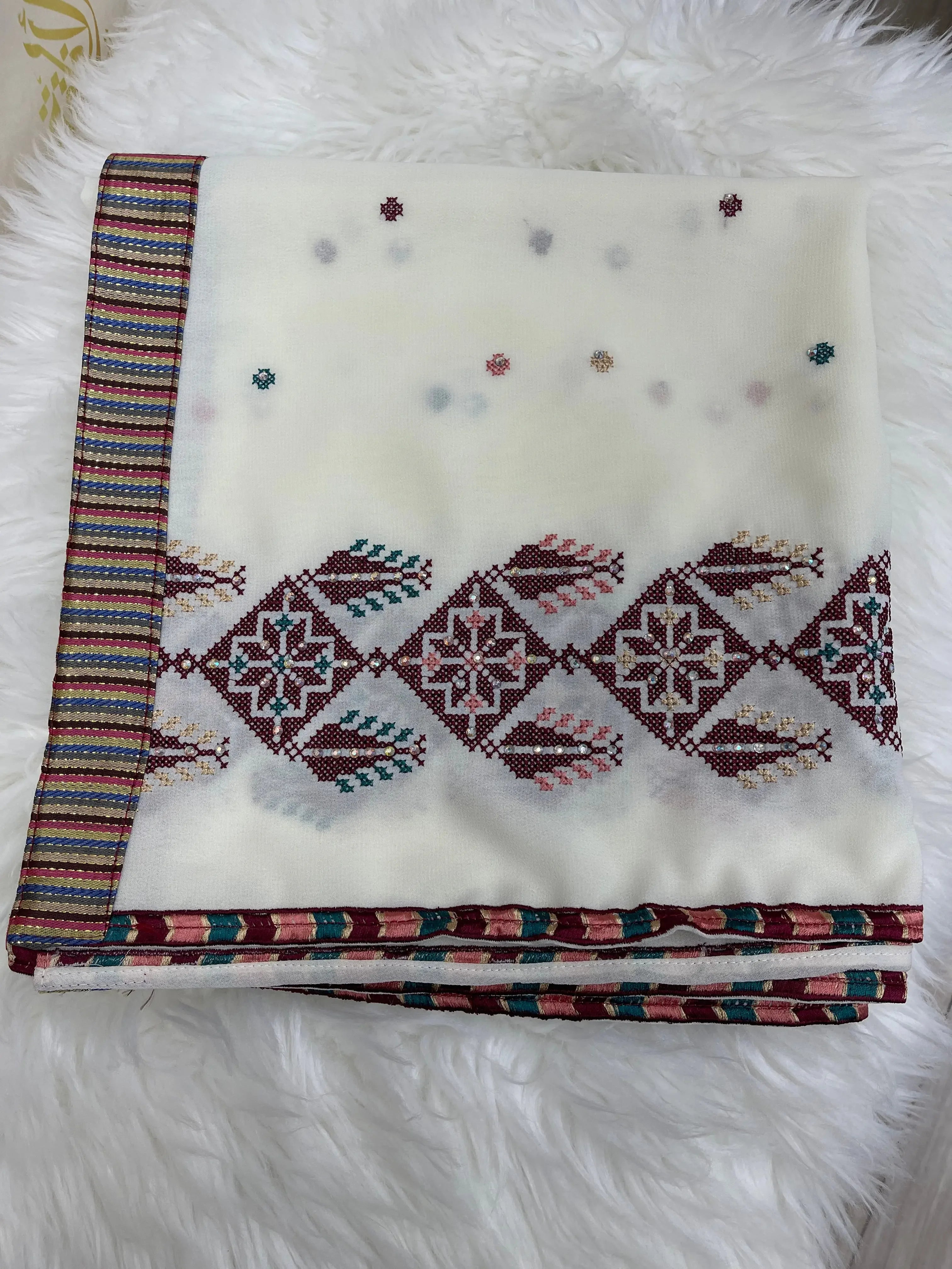 Palestinian Elegance embroidered saya khirka shawl with intricate colorful embroidery on white fabric