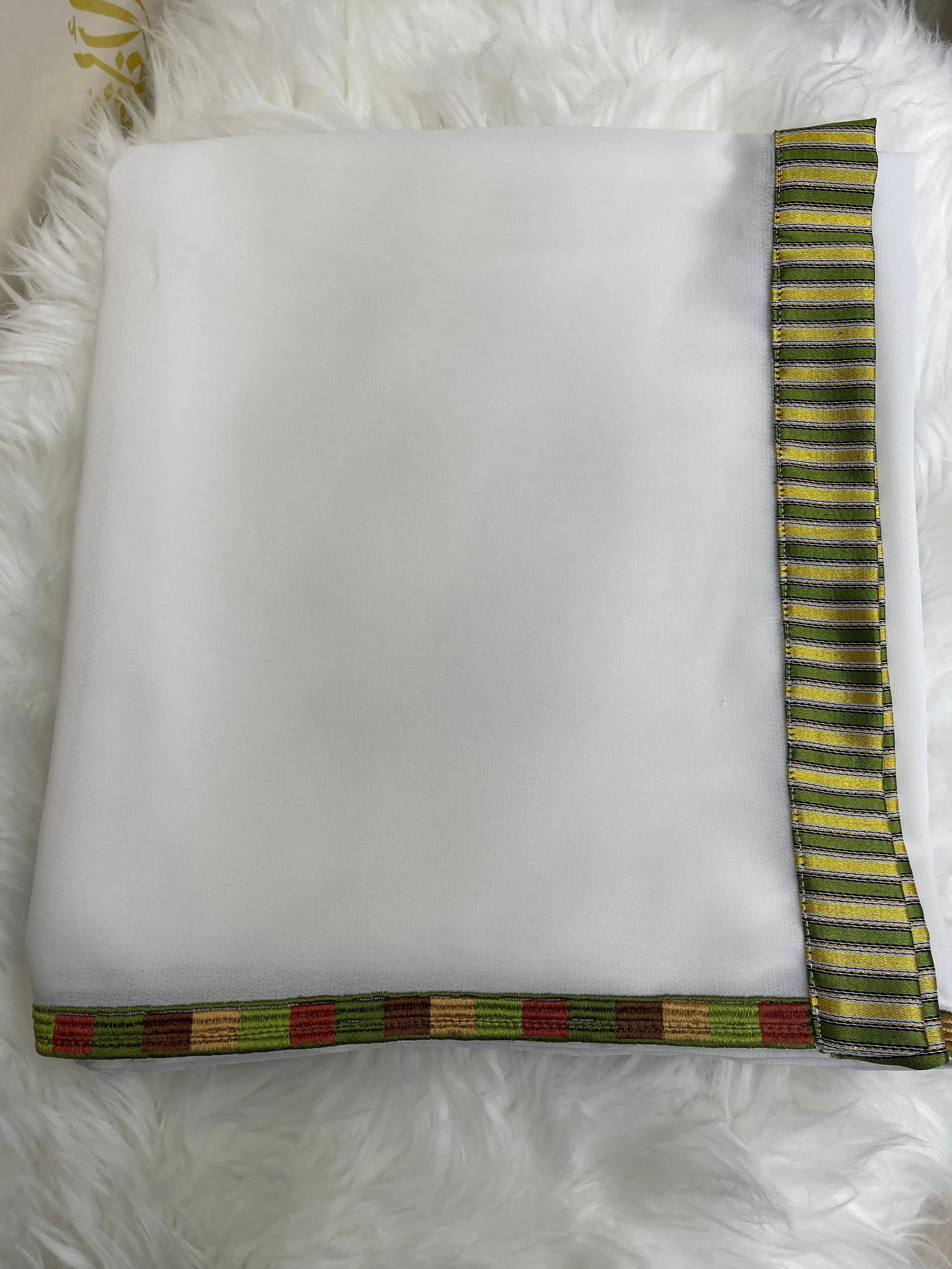 Embroidered saya khirka shawl with white fabric and colorful striped borders by Palestinian Elegance