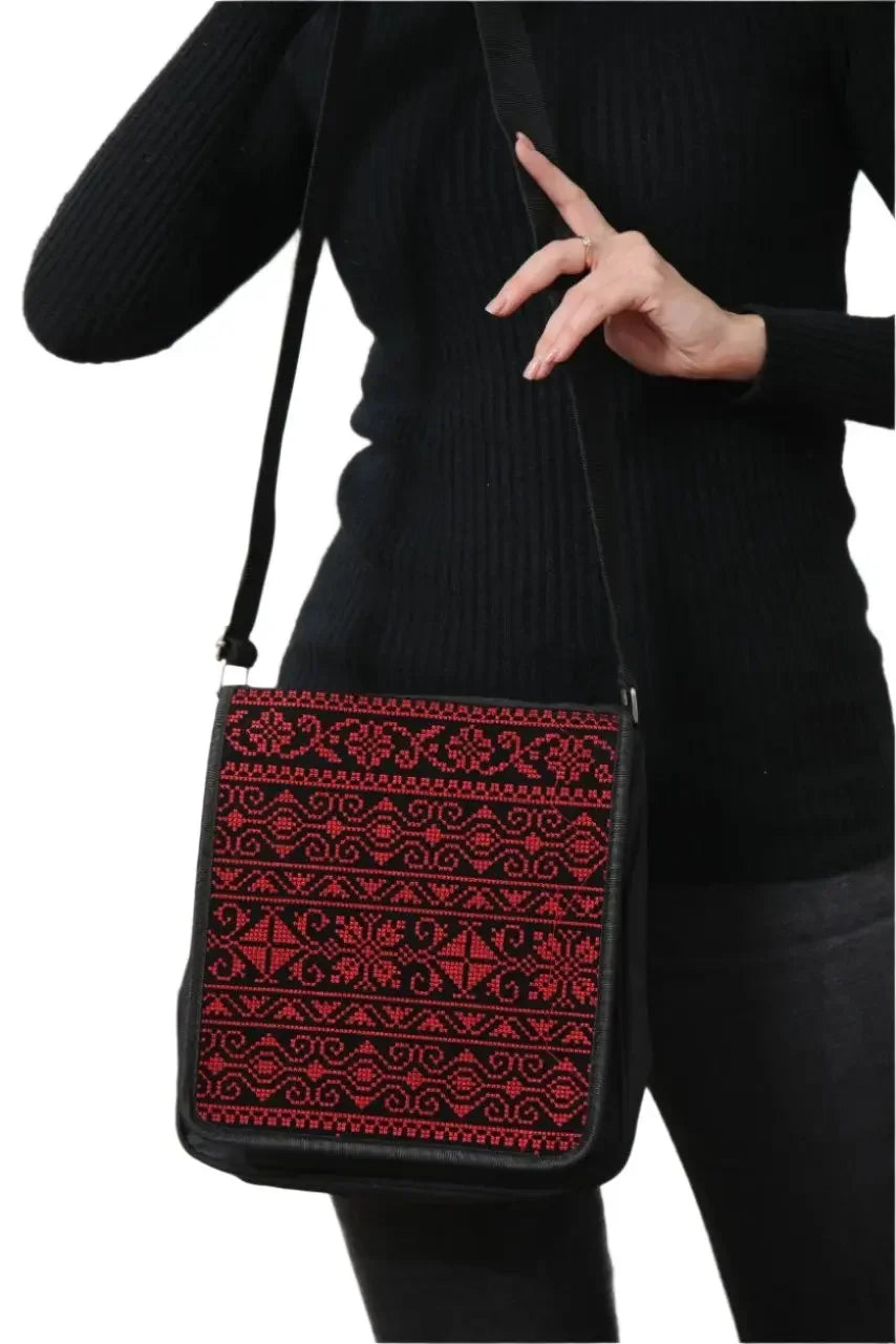 Palestinian Elegance embroidered shoulder bag in black with red traditional patterns and adjustable strap