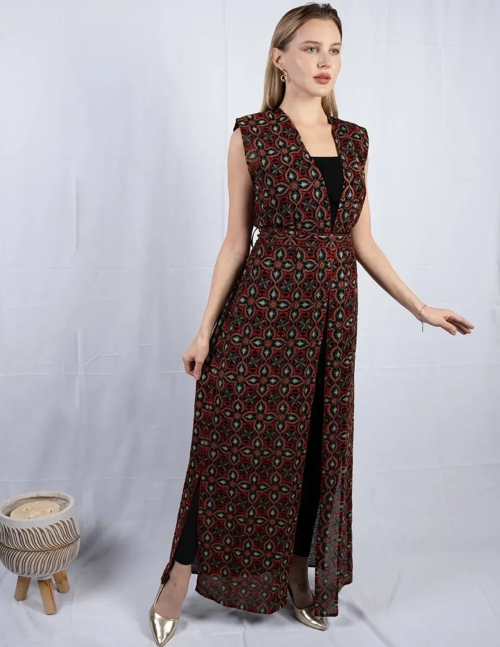 Palestinian Elegance embroidered sleeveless cardigan with intricate patterns styled over black outfit