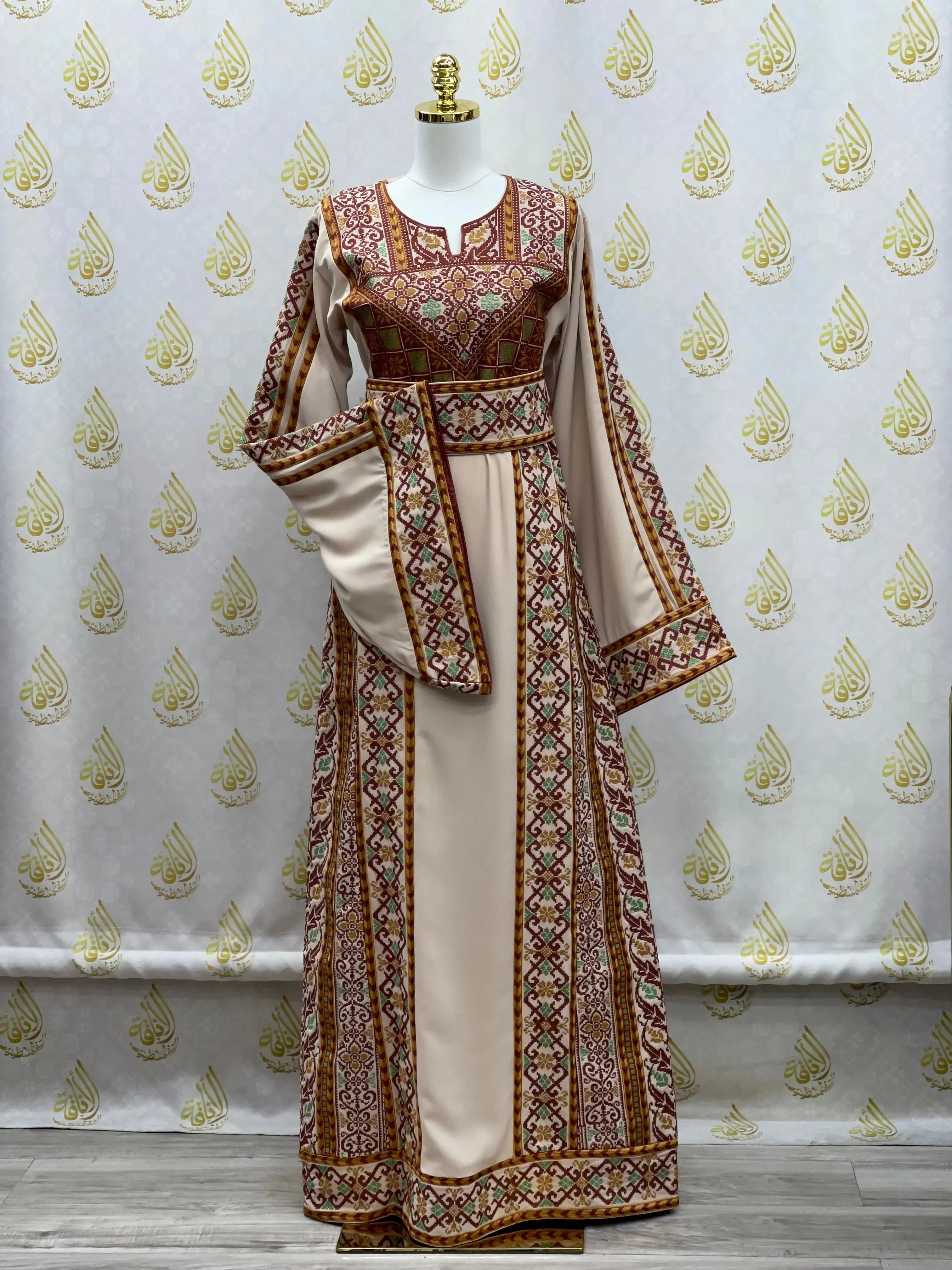 Palestinian Elegance embroidered thoub dress with intricate traditional embroidery on beige fabric