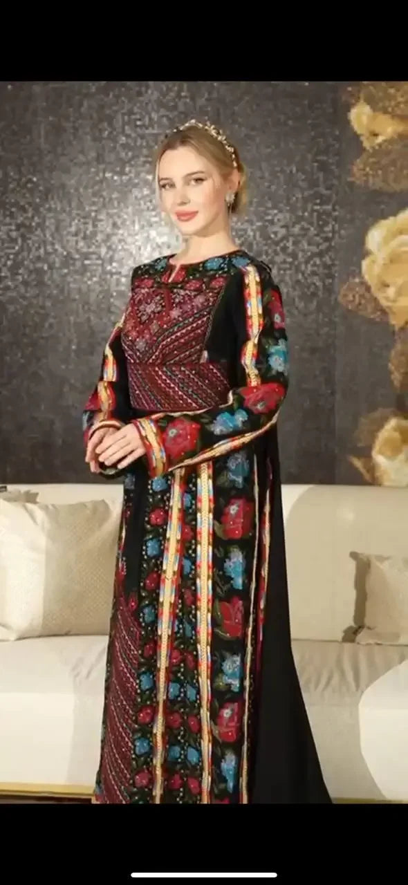 Palestinian Elegance embroidered thoub dress with intricate red and blue floral embroidery on black fabric