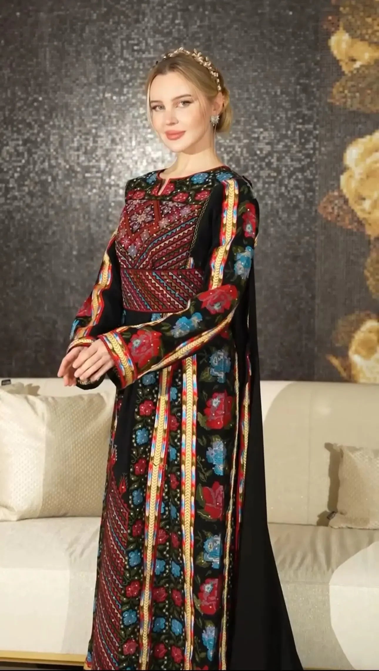 Palestinian Elegance embroidered thoub dress featuring vibrant floral embroidery on black fabric