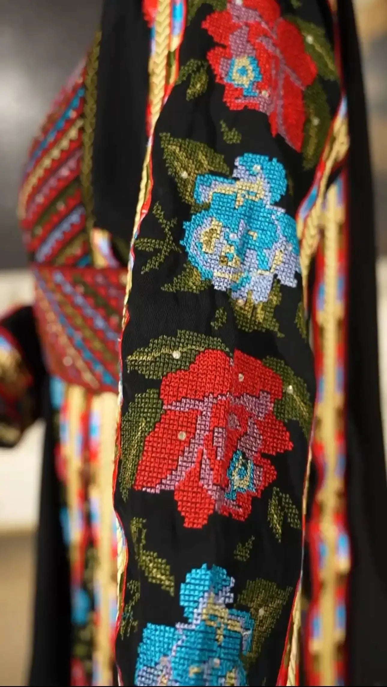 Palestinian Elegance embroidered thoub dress with colorful floral embroidery on black fabric