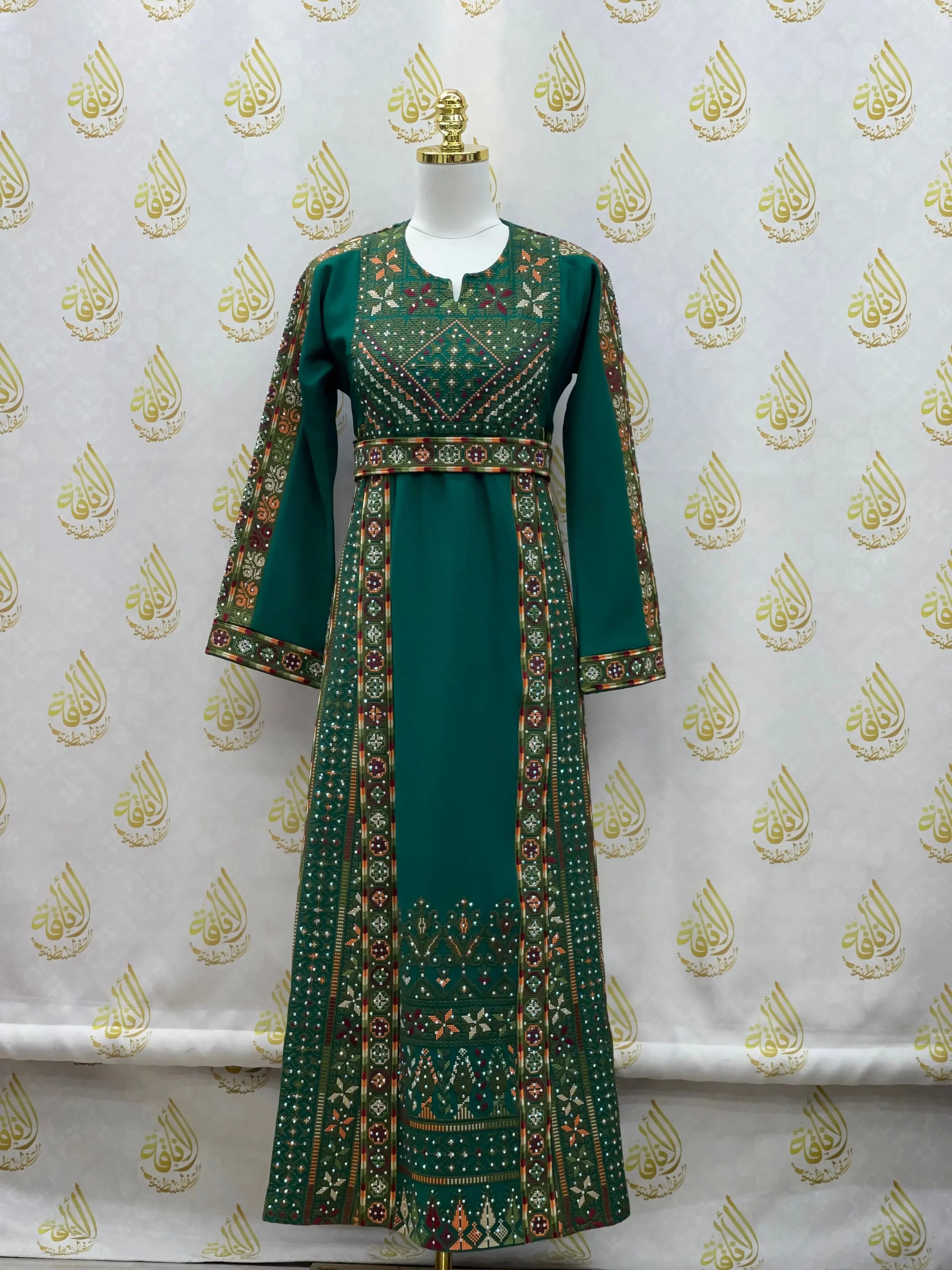 Green embroidered thoub for girls with intricate traditional Palestinian Elegance embroidery details