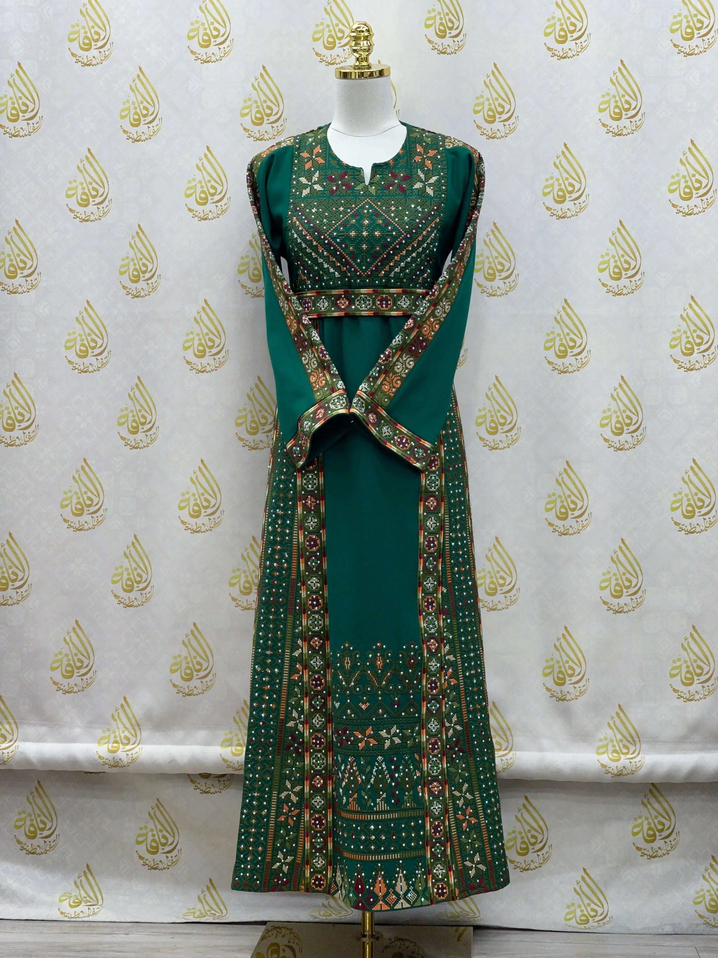 Palestinian Elegance green embroidered thoub for girls with intricate traditional patterns