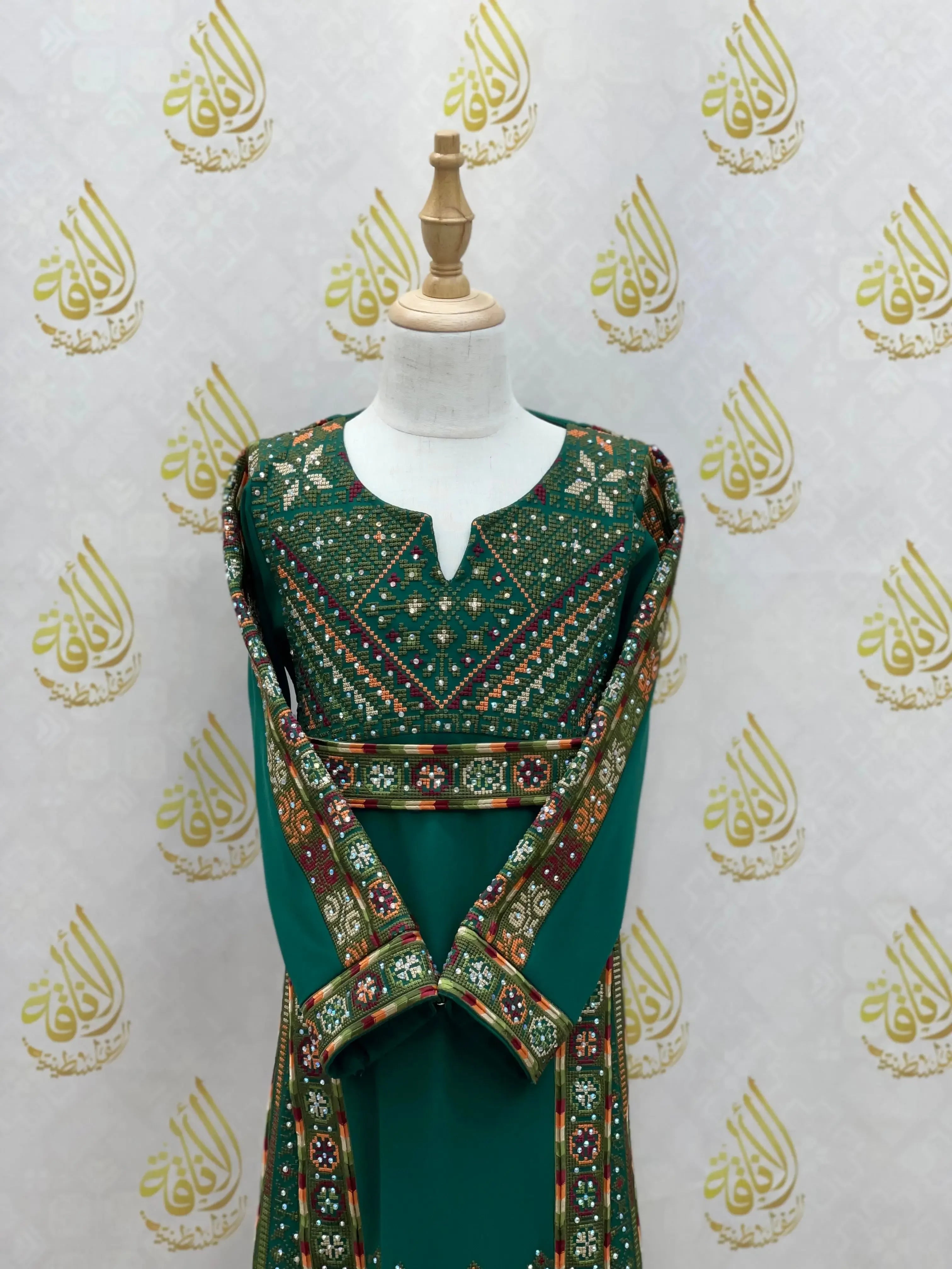 Green embroidered thoub for girls with intricate traditional Palestinian Elegance embroidery design