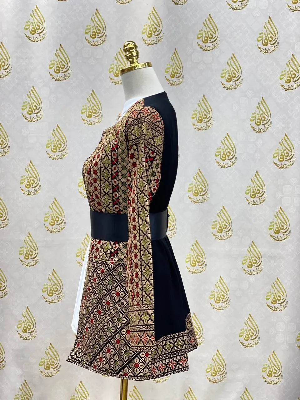 Palestinian Elegance embroidered women's jacket with intricate traditional patterns in black and gold