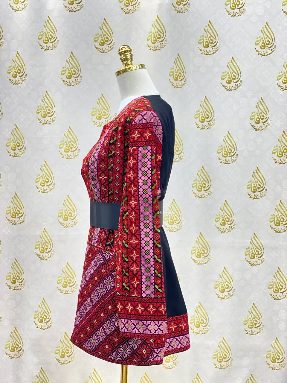 Palestinian Elegance embroidered women's jacket with vibrant traditional red and pink geometric patterns
