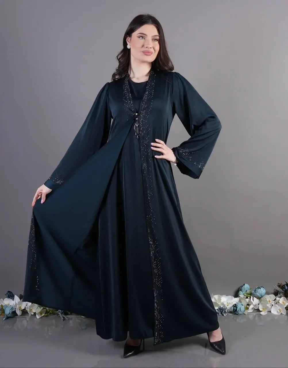 Palestinian Elegance black fancy abaya for occasions with beaded trim and flowing sleeves