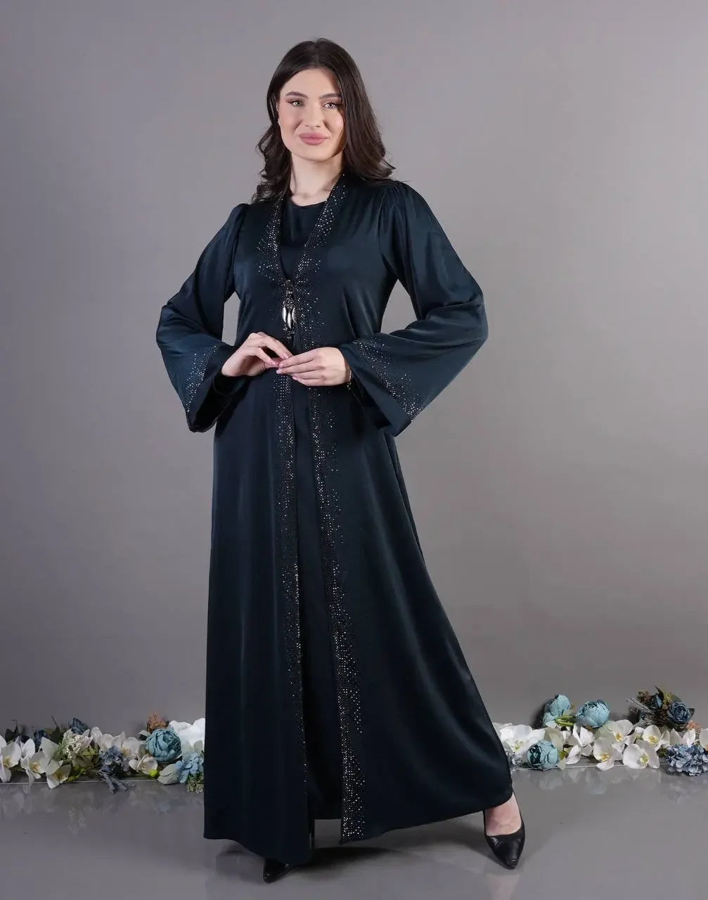 Palestinian Elegance black fancy abaya for occasions with subtle decorative details and long sleeves
