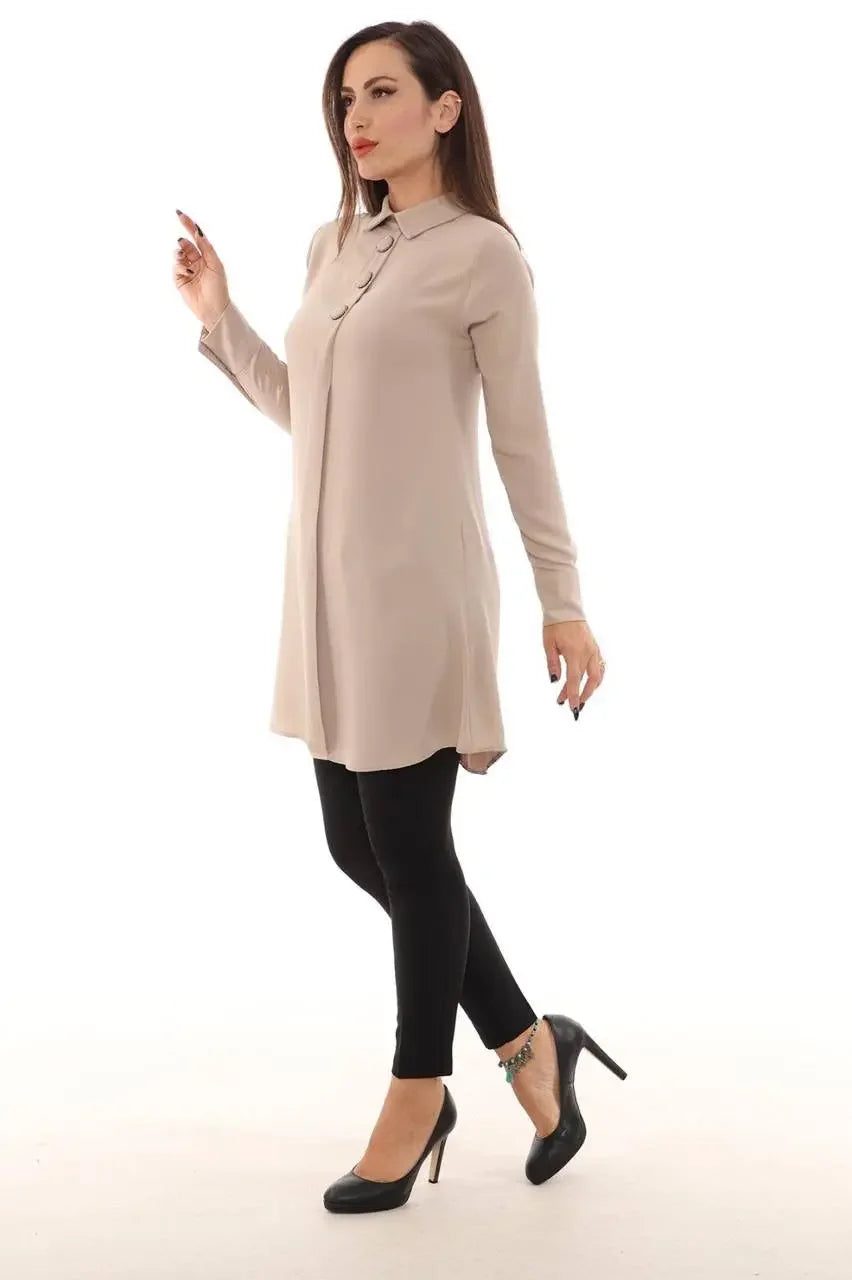 Palestinian Elegance formal tunic for women in beige with long sleeves and high collar paired with black leggings