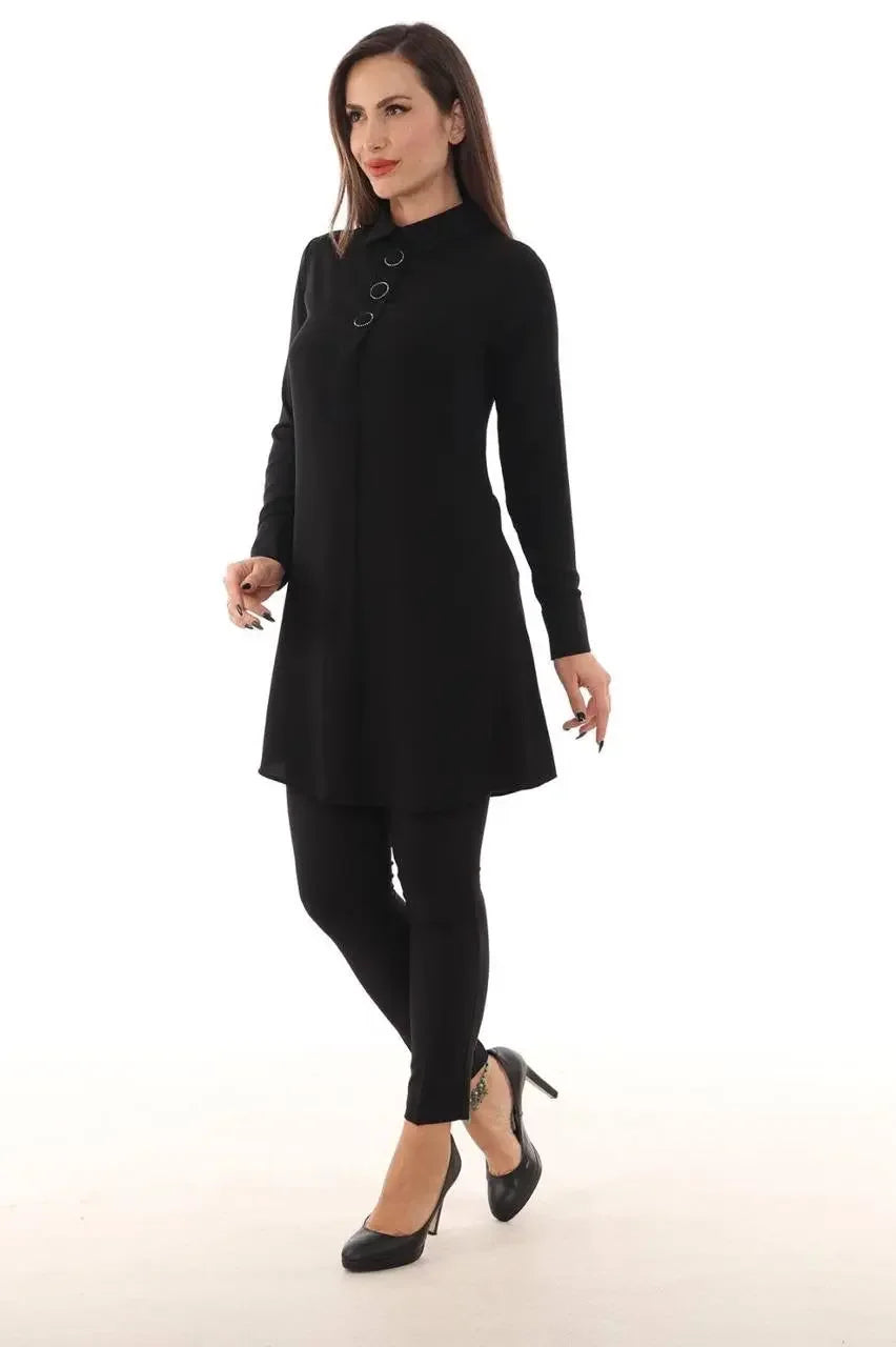 Palestinian Elegance black formal tunic for women with long sleeves and button detail paired with black leggings and heels