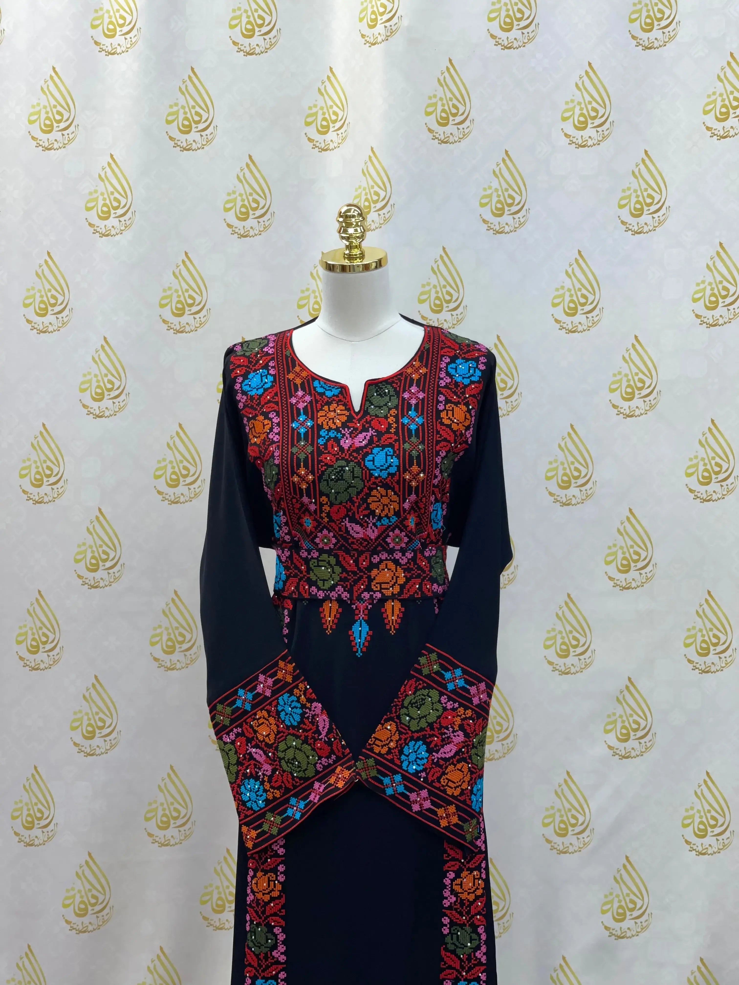 Palestinian Elegance black hand-embroidered abaya with colorful floral embroidery on chest and sleeves