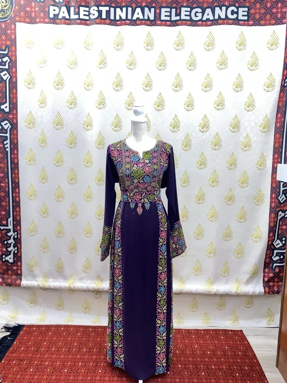 Palestinian Elegance deep purple hand-embroidered abaya with colorful floral patterns and long sleeves