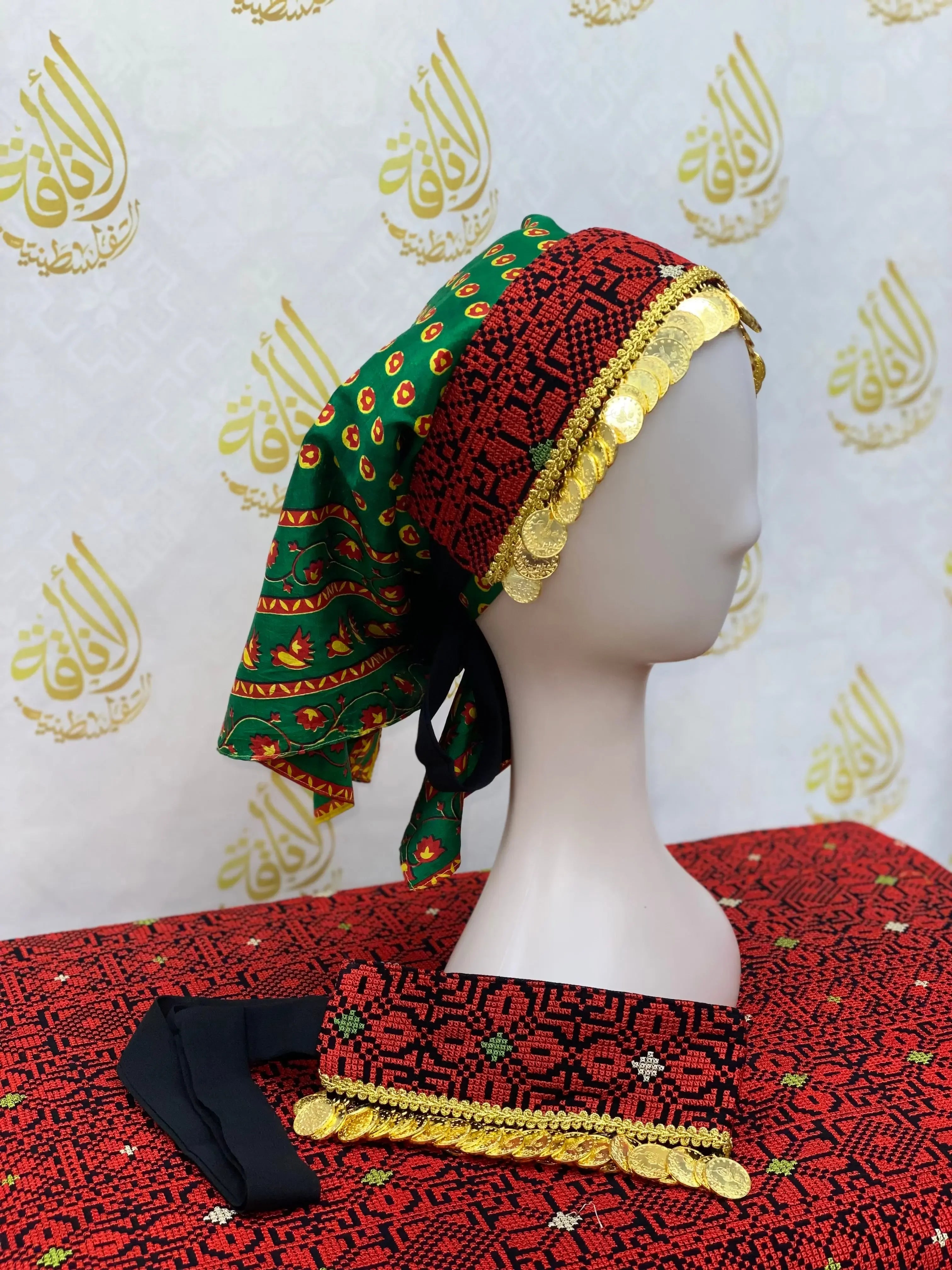Hand embroidered tatreez headscarf in red and green with gold coin accents by Palestinian Elegance