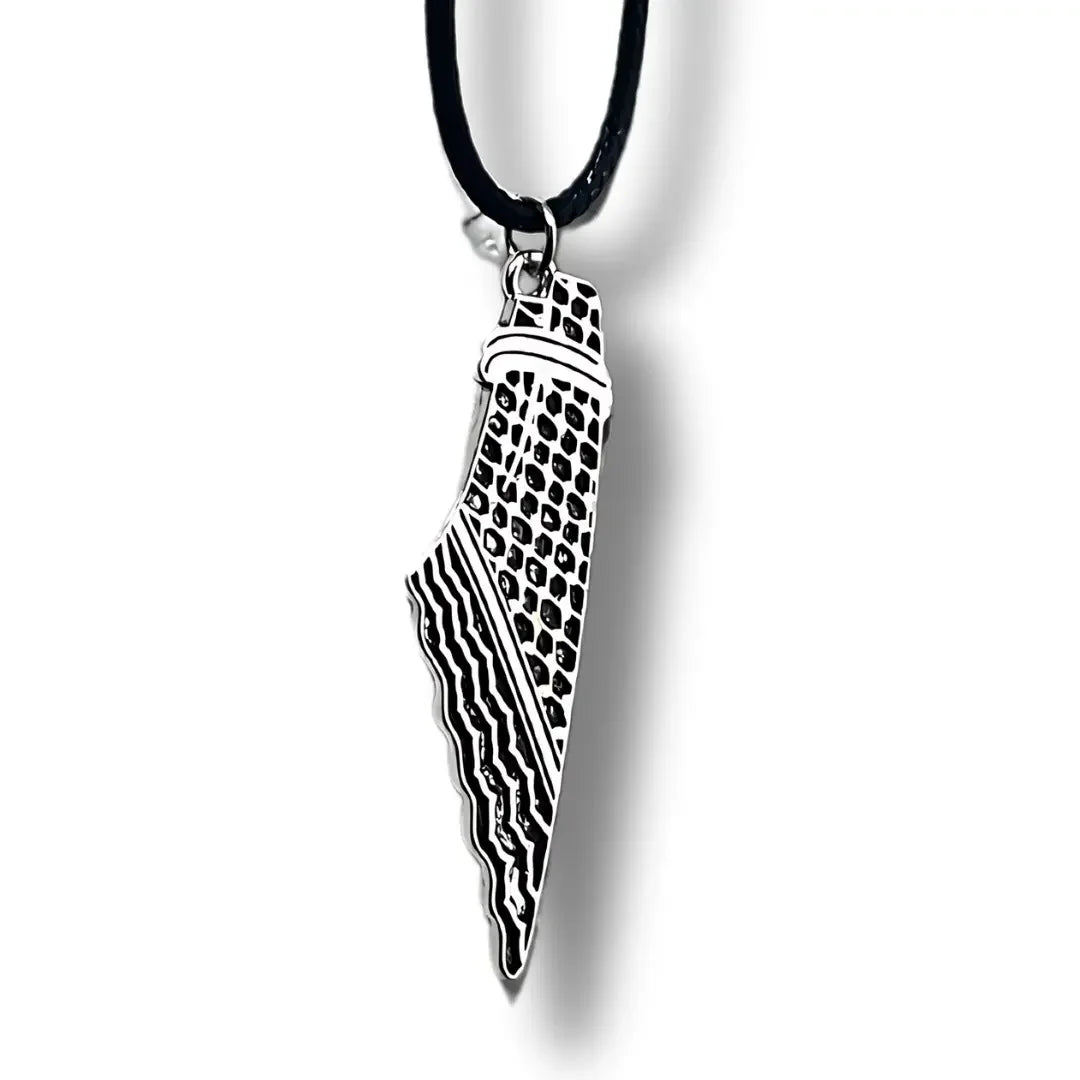 Palestinian Elegance handcrafted kuffiyeh necklace with black cord and detailed silver pendant