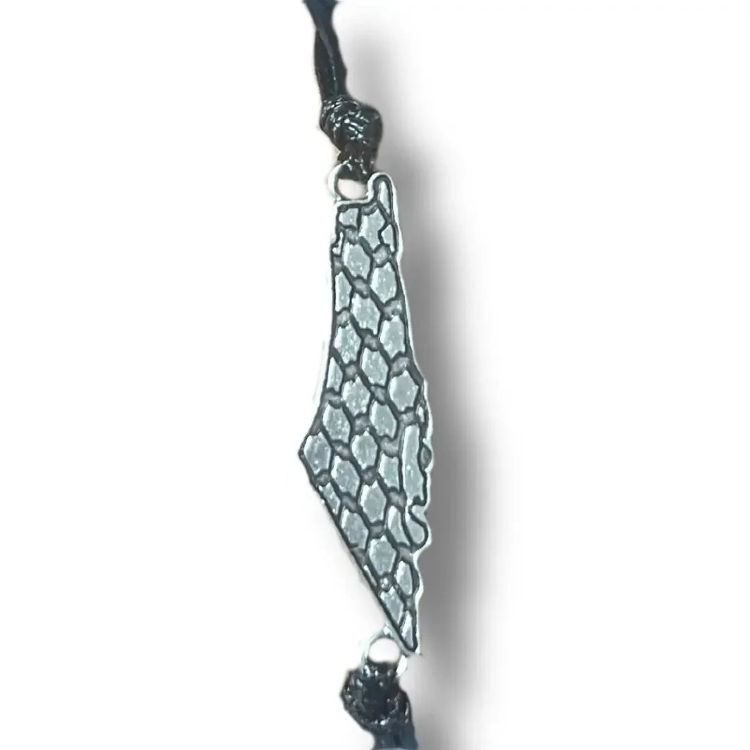 Handcrafted Palestine bracelet with metal map pendant and black woven cord by Palestinian Elegance