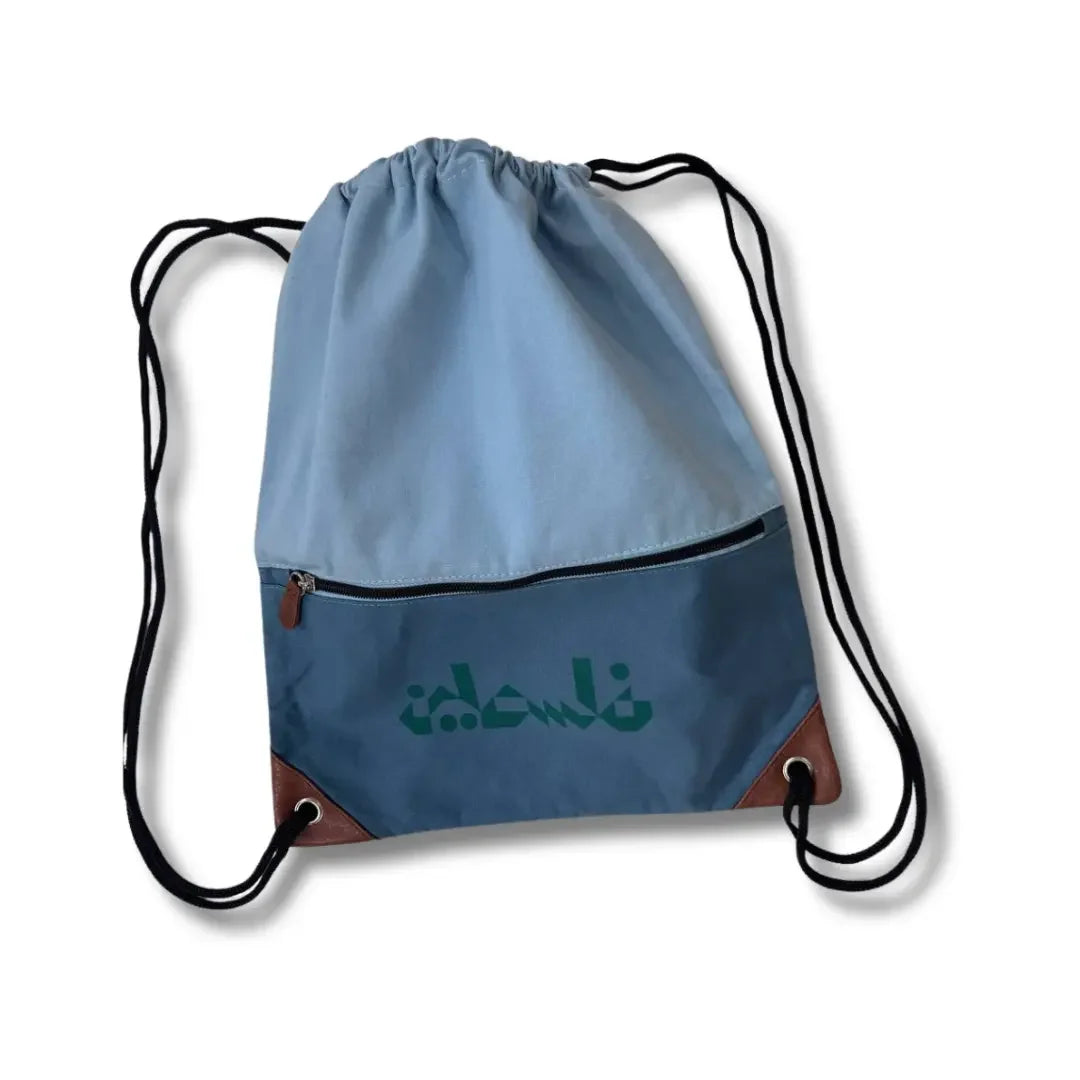 Blue drawstring bag with front zipper pocket and black straps handmade Palestine backpack by Palestinian Elegance