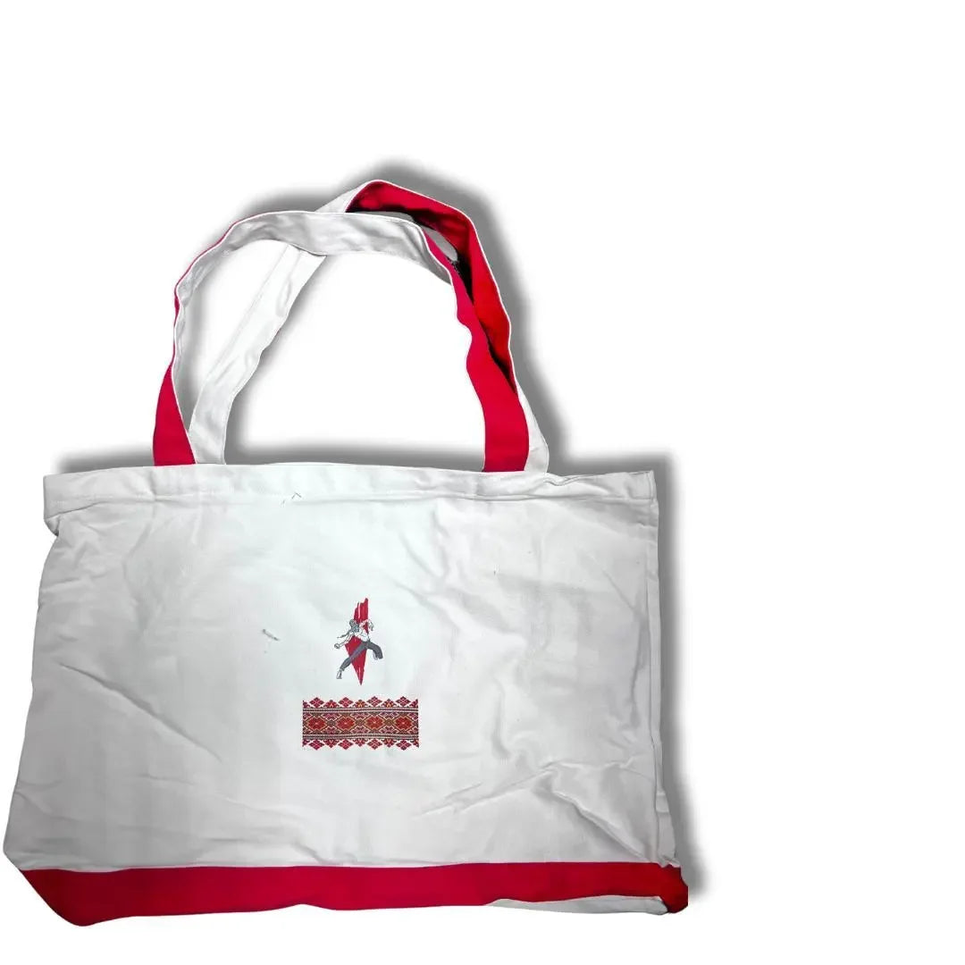Handmade Palestine tote bag with white fabric, red accents, and traditional embroidery design