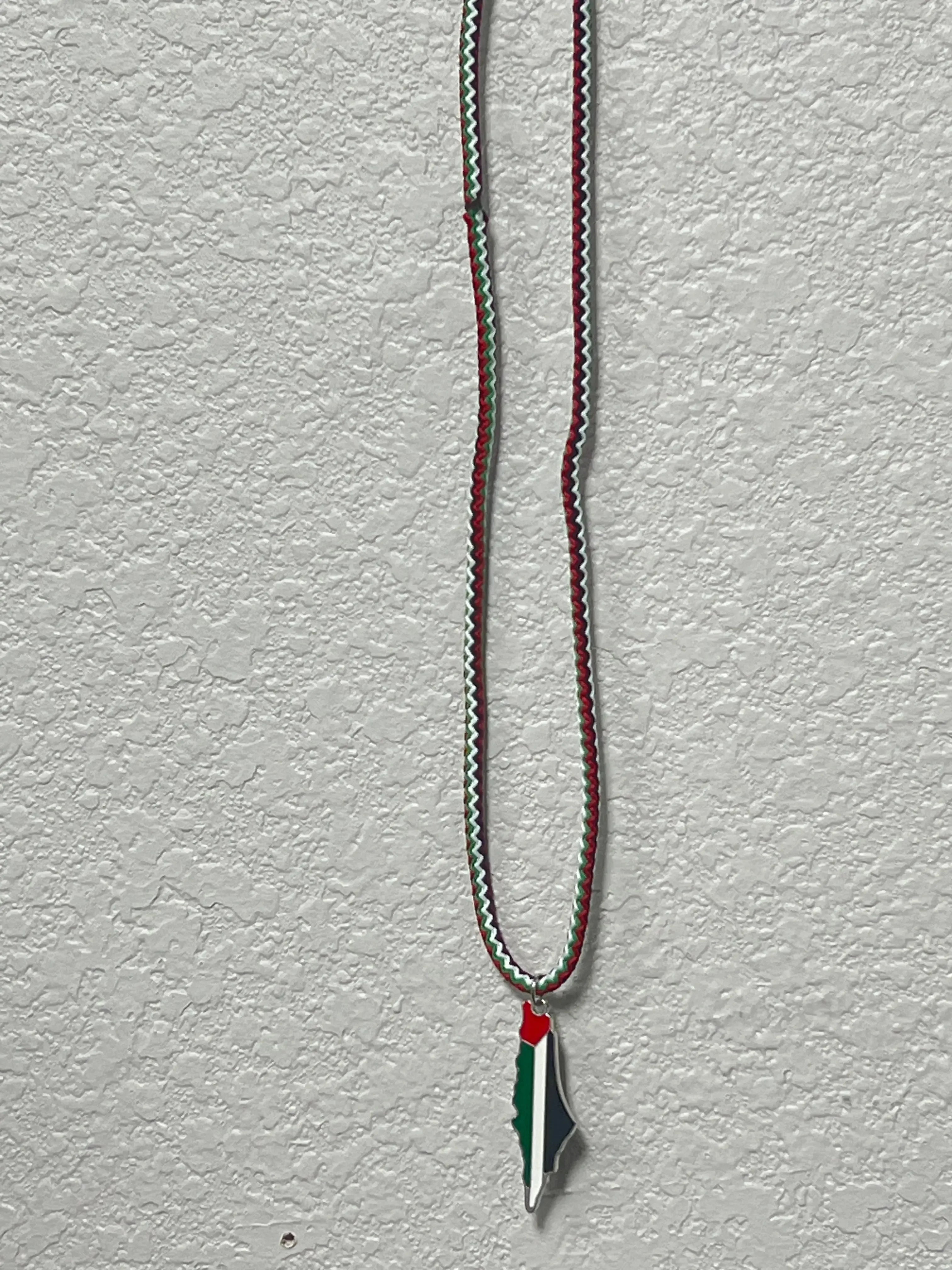 Handmade Palestinian silver necklace with a pendant in the shape of Palestine in national colors