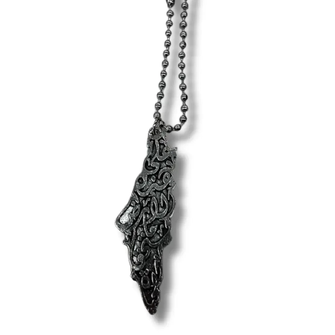 Handmade Palestinian silver necklace with intricate Arabic calligraphy pendant on ball chain