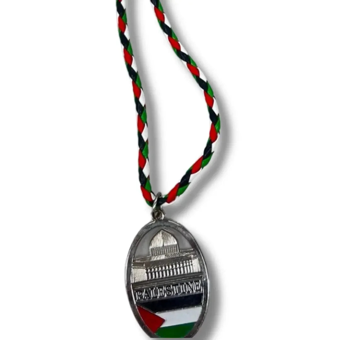 Handmade Palestinian silver necklace with Dome of the Rock pendant and braided red black green white cord