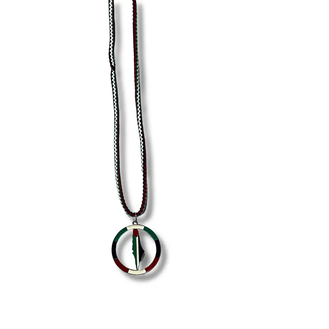Handmade Palestinian silver necklace with a circular pendant featuring the Palestinian flag colors