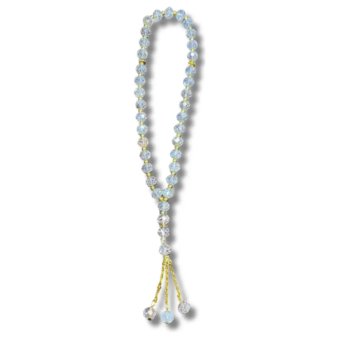 Handmade Palestinian tasbeeh with clear beads and gold accents from Palestinian Elegance