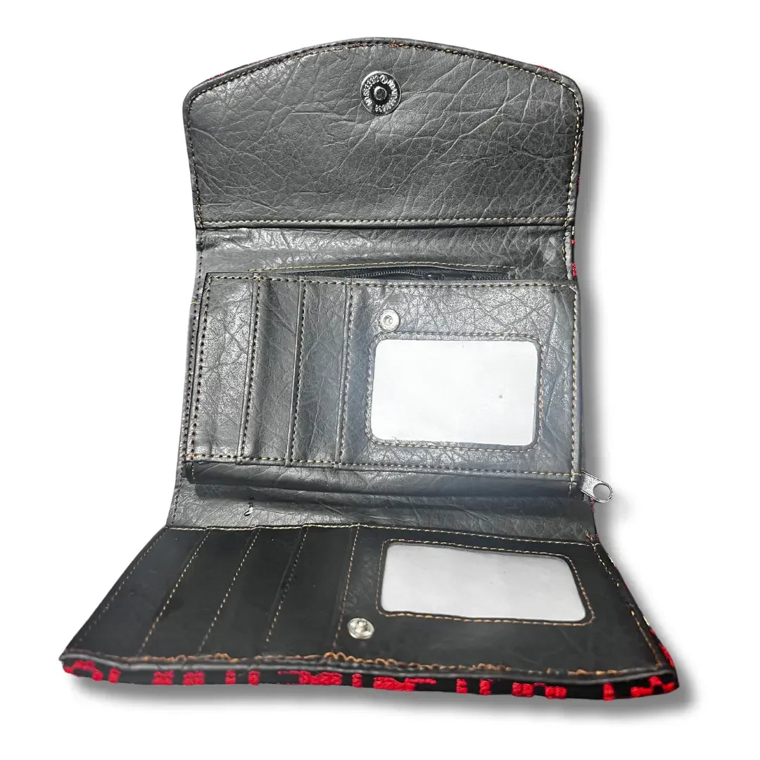 Handmade tatreez wallet by Palestinian Elegance with multiple card slots and ID window in black leather