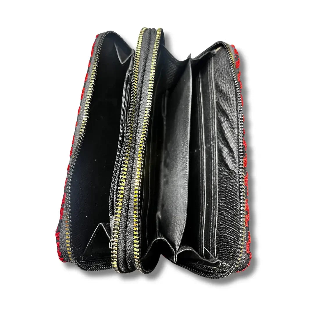 Open handmade tatreez wallet by Palestinian Elegance showing multiple compartments and zipper closure