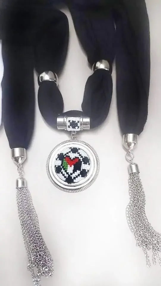 Palestinian Elegance heritage embroidered scarf with silver tassels and intricate circular pendant