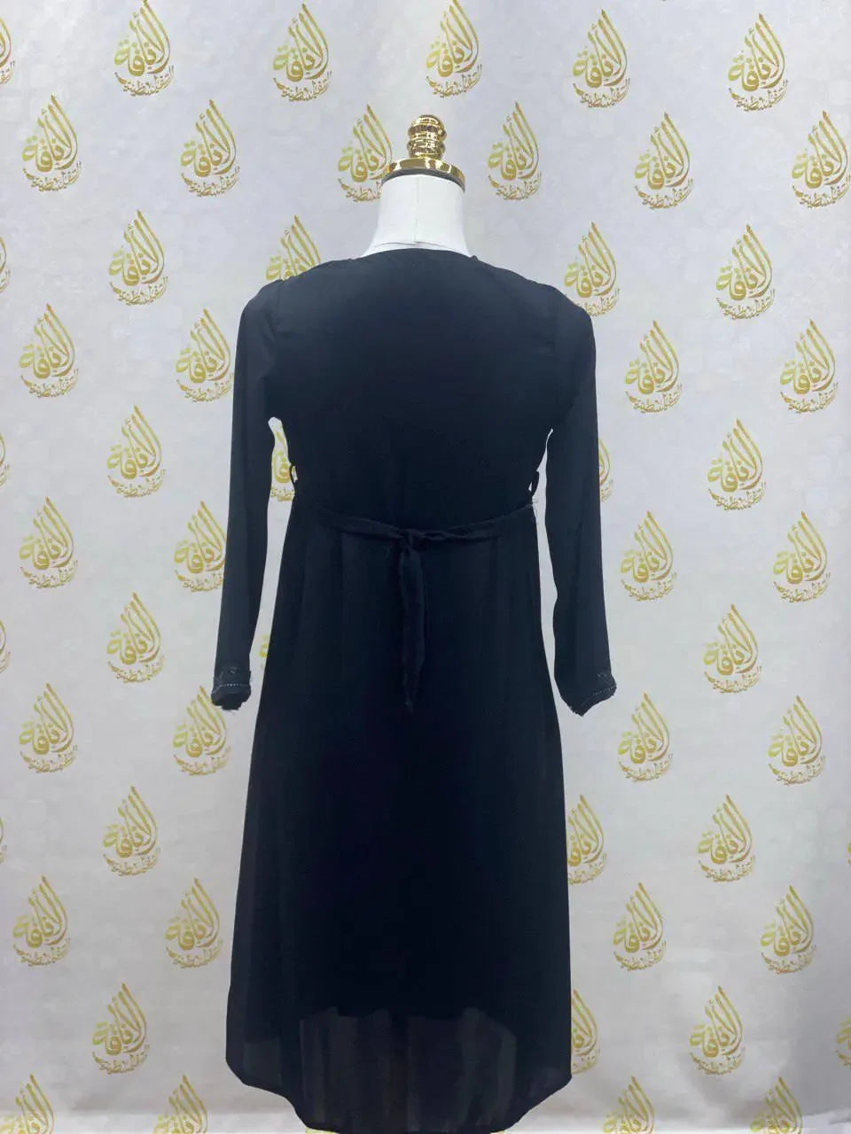 Palestinian Elegance black kids abaya with zipper featuring long sleeves and back tie detail