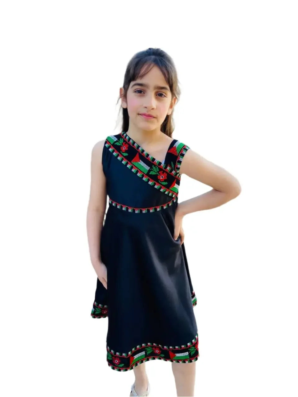 Girl wearing a black kids Palestine dress with traditional embroidered patterns by Palestinian Elegance