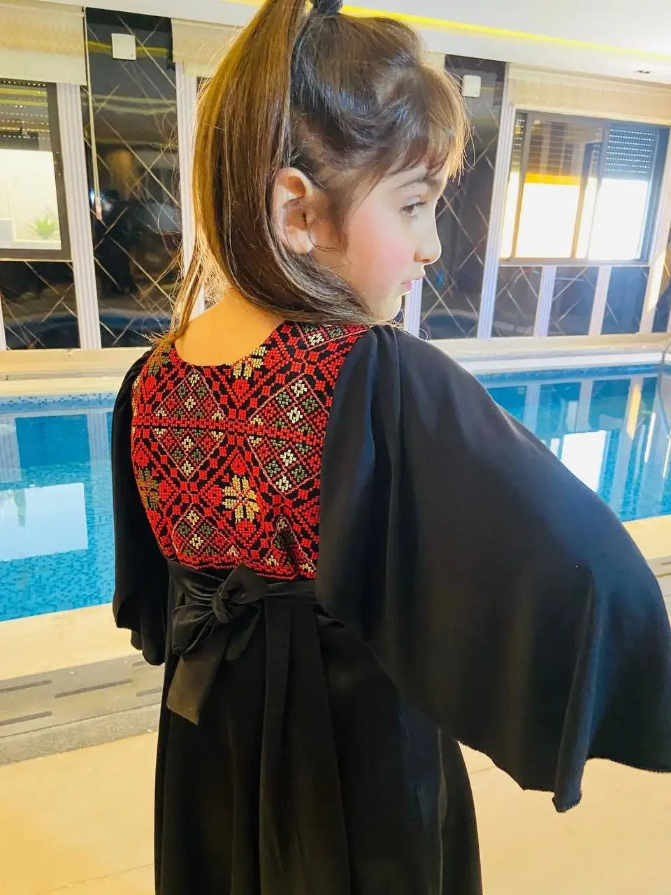 Palestinian Elegance kids tatreez dress with traditional red embroidery and black fabric for girls